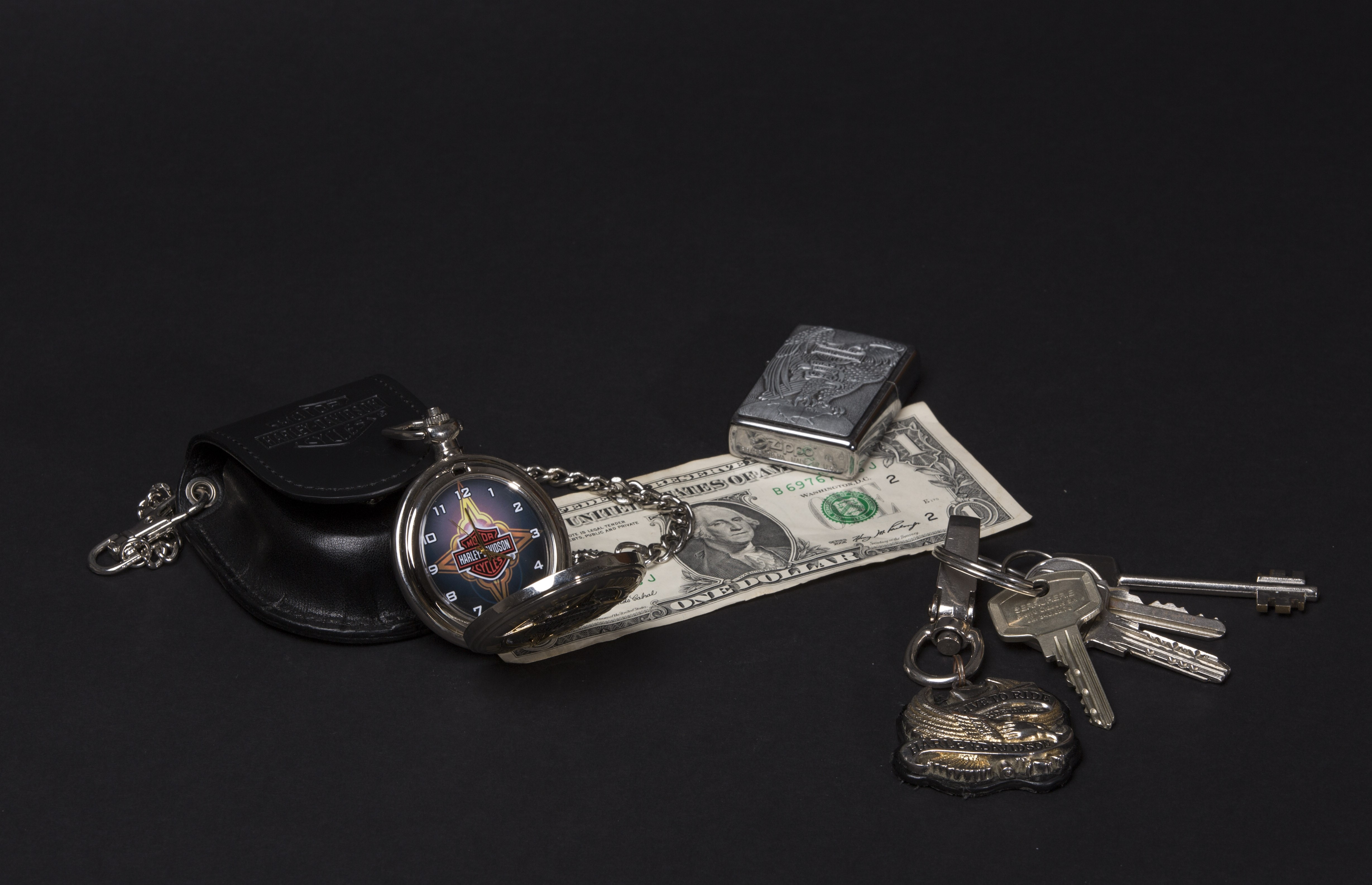 Harley-Davidson pocket watch, dollar bill, lighter, and keys HD Wallpaper