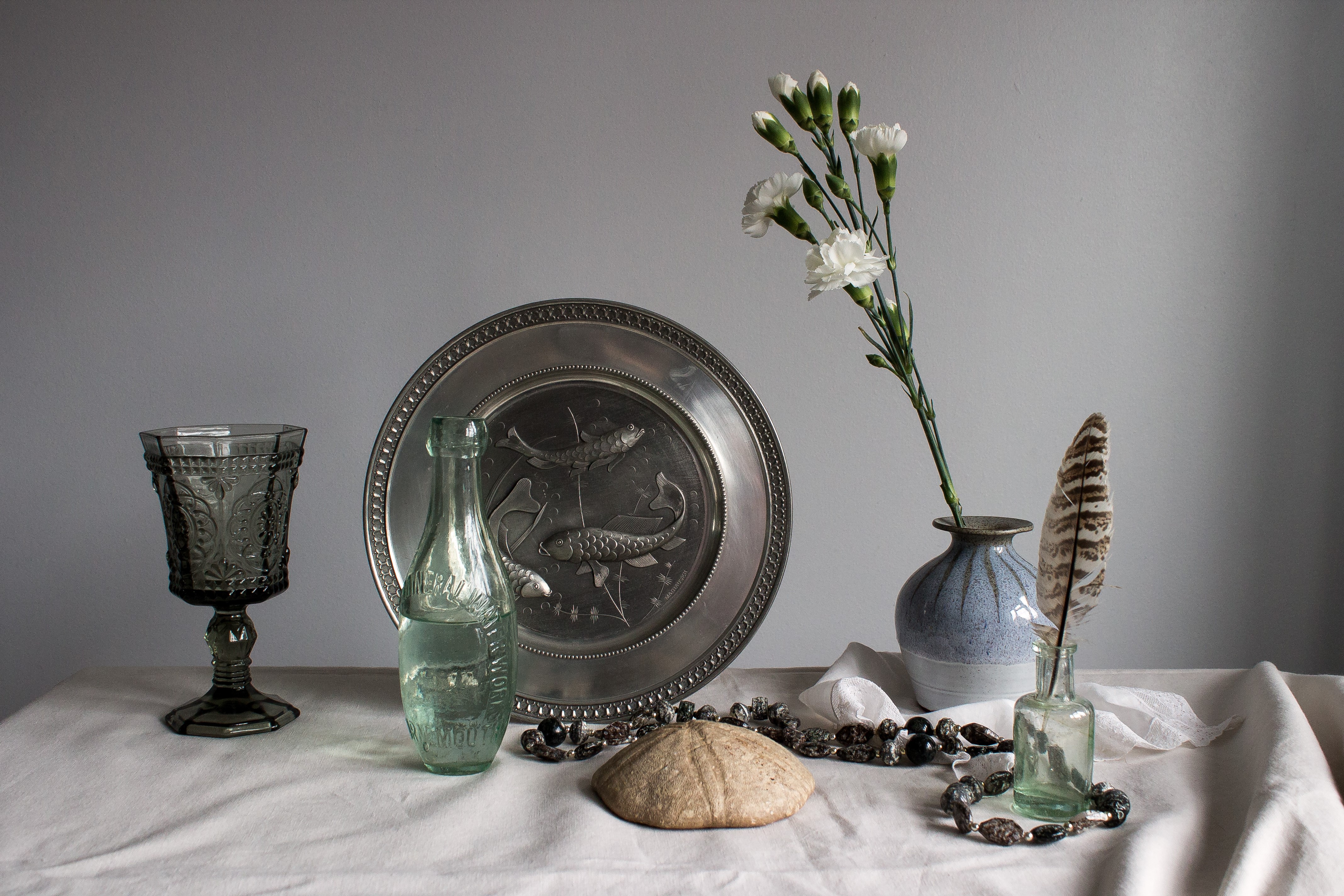 Still-life with Carnations, Plate, Stemware, Bottle, and Feather HD Wallpaper