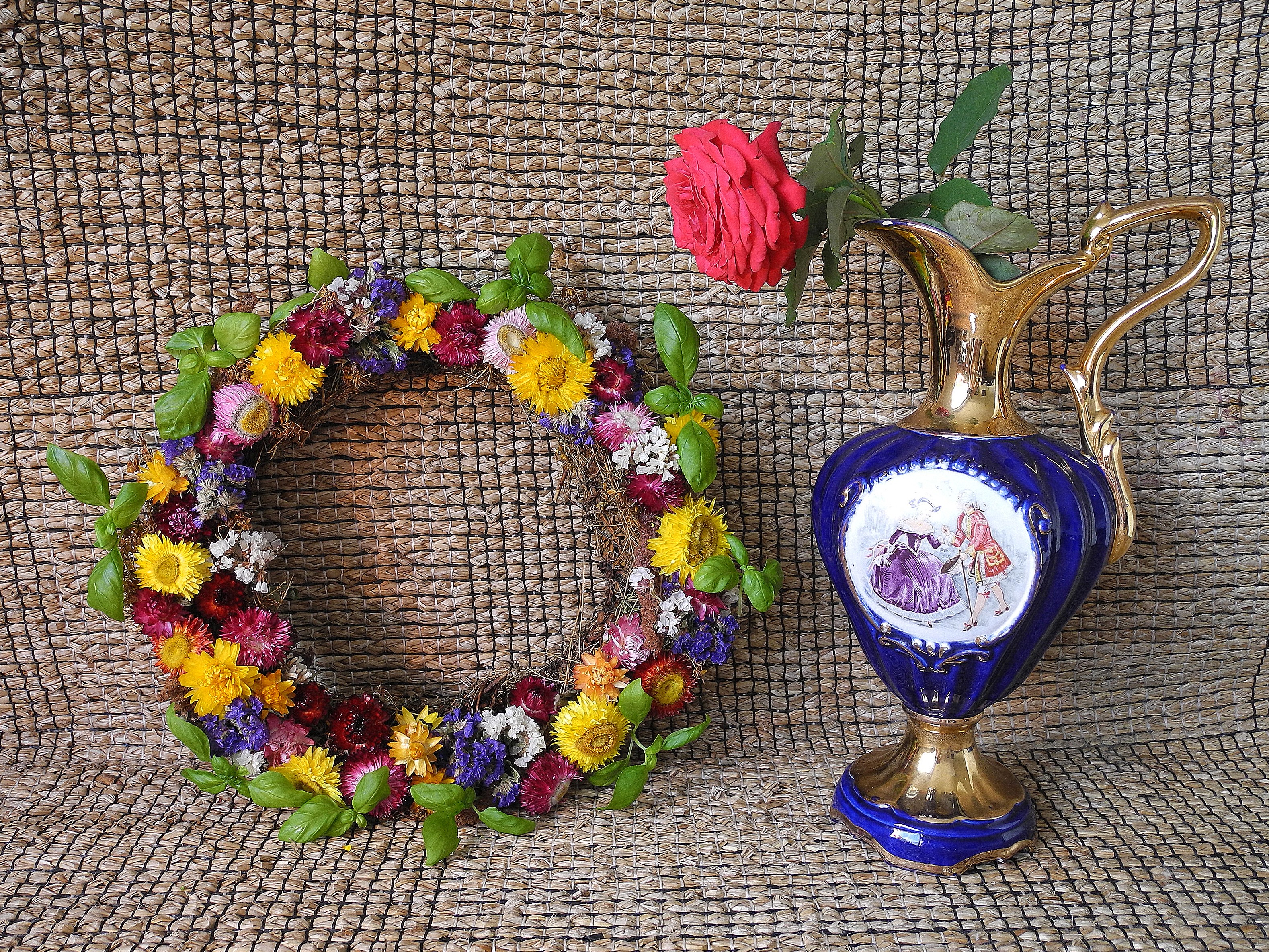 Still life with dried flower wreath and rose in a jug HD Wallpaper