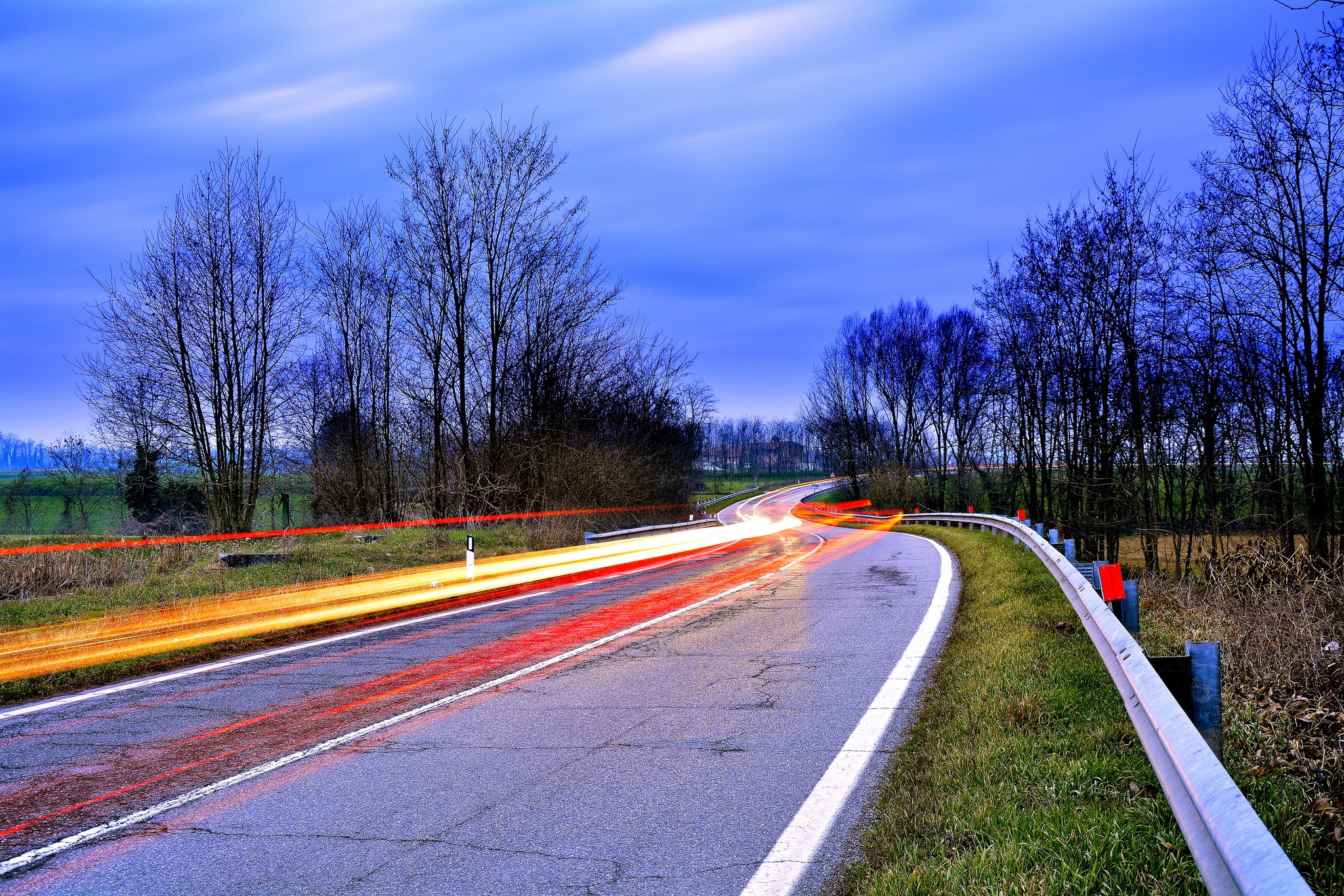 Road with light trails at dusk HD Wallpaper
