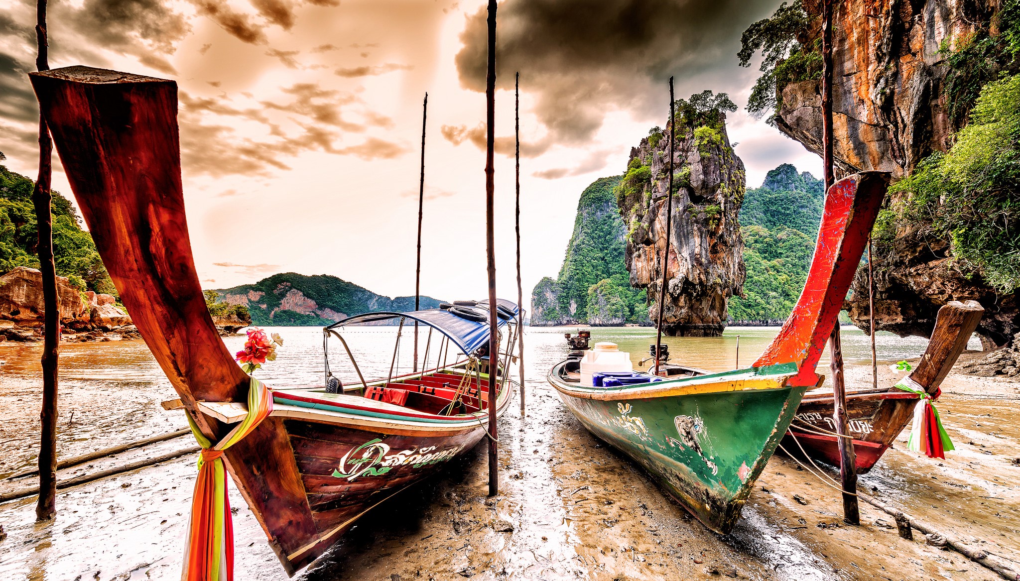 Longtail boats on a muddy shore in Phang Nga Province, Thailand HD Wallpaper
