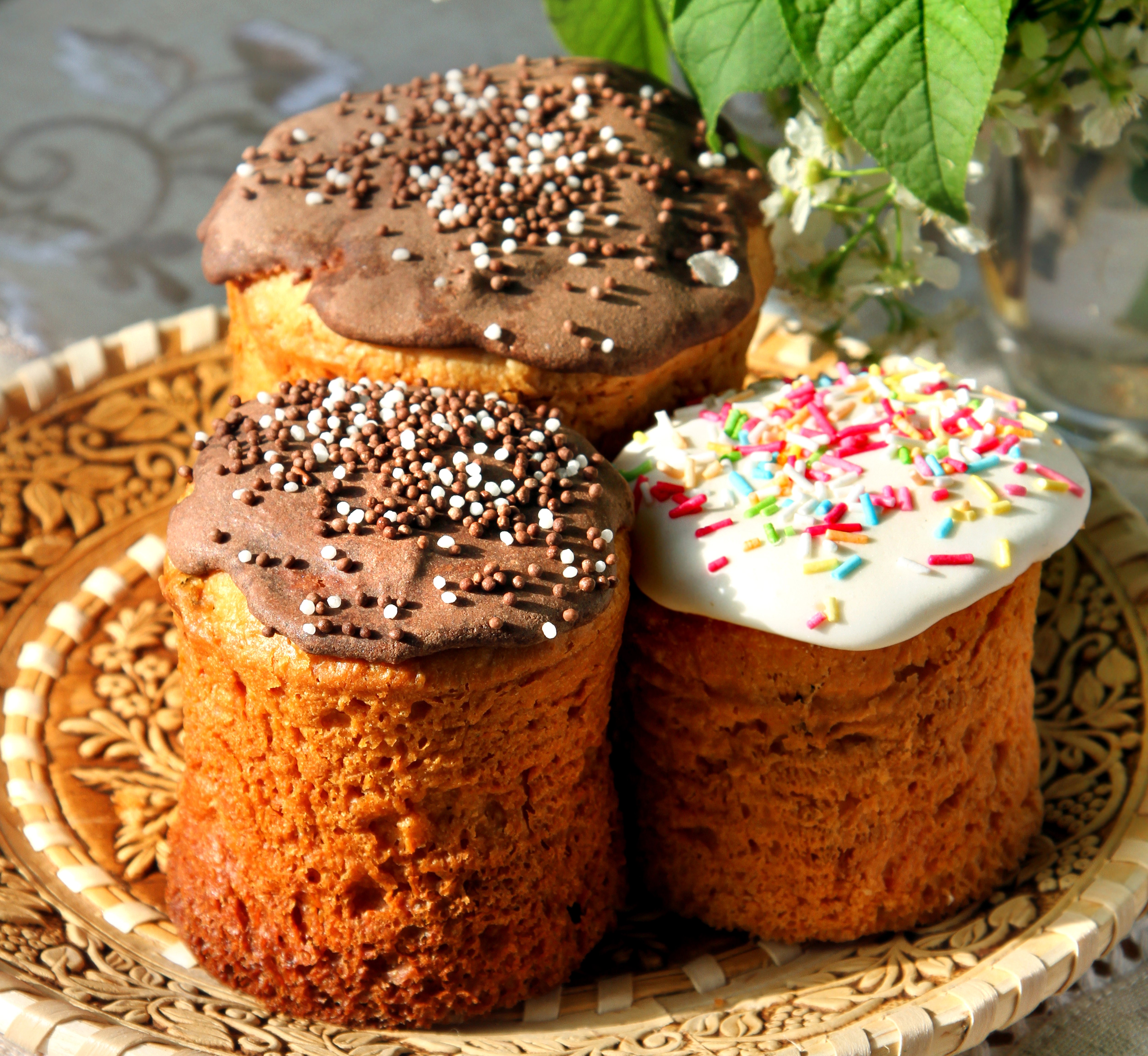 Three Easter Kulich pastries on a decorative plate HD Wallpaper