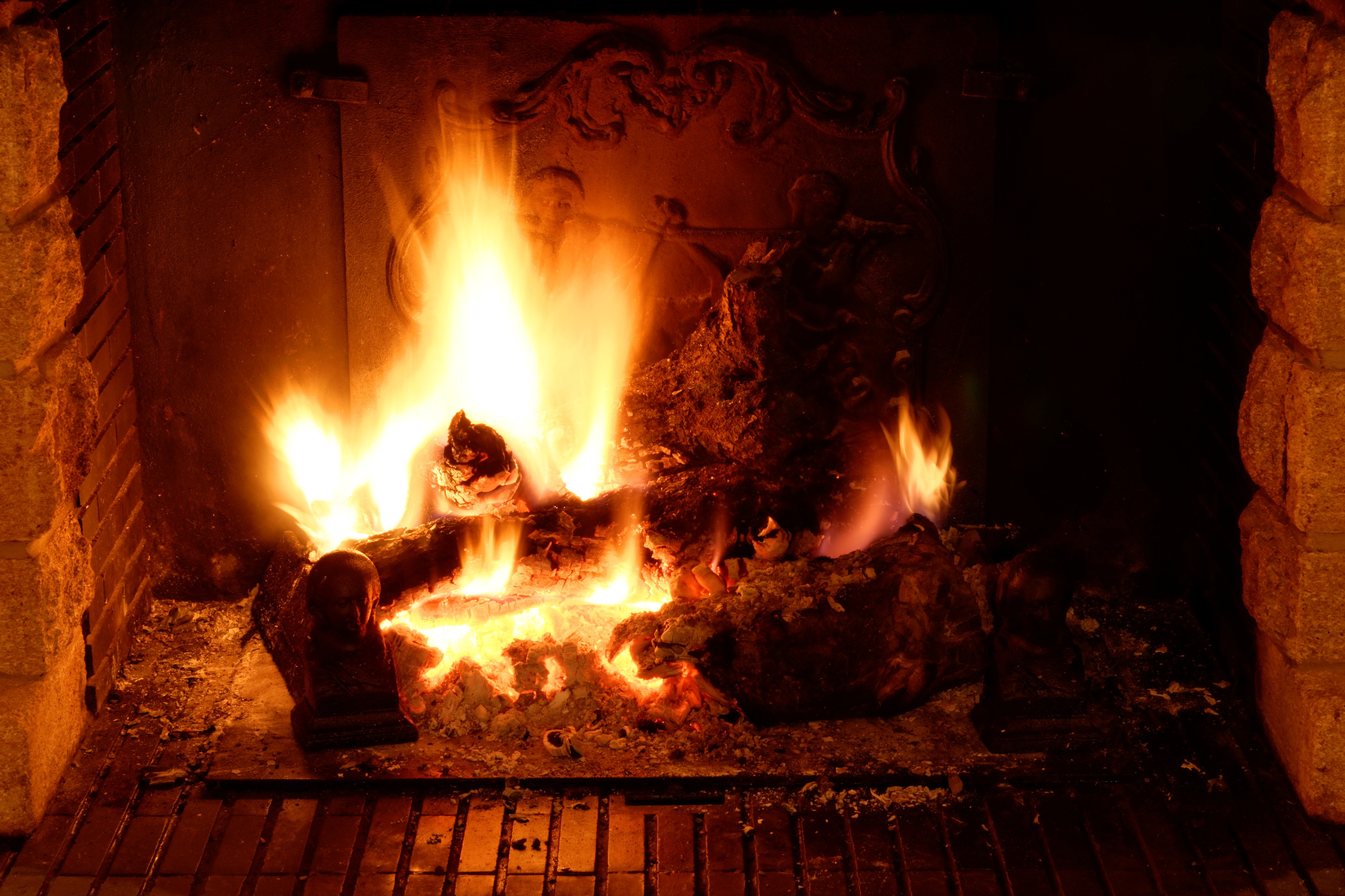 Fireplace with burning logs HD Wallpaper