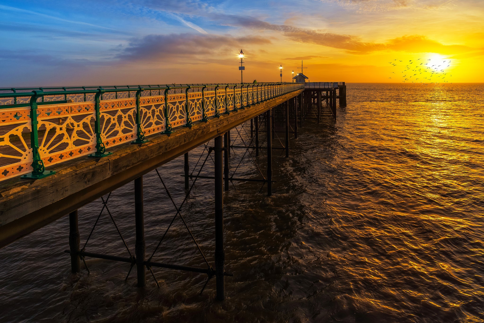 Penarth Pier at sunset over the sea HD Wallpaper