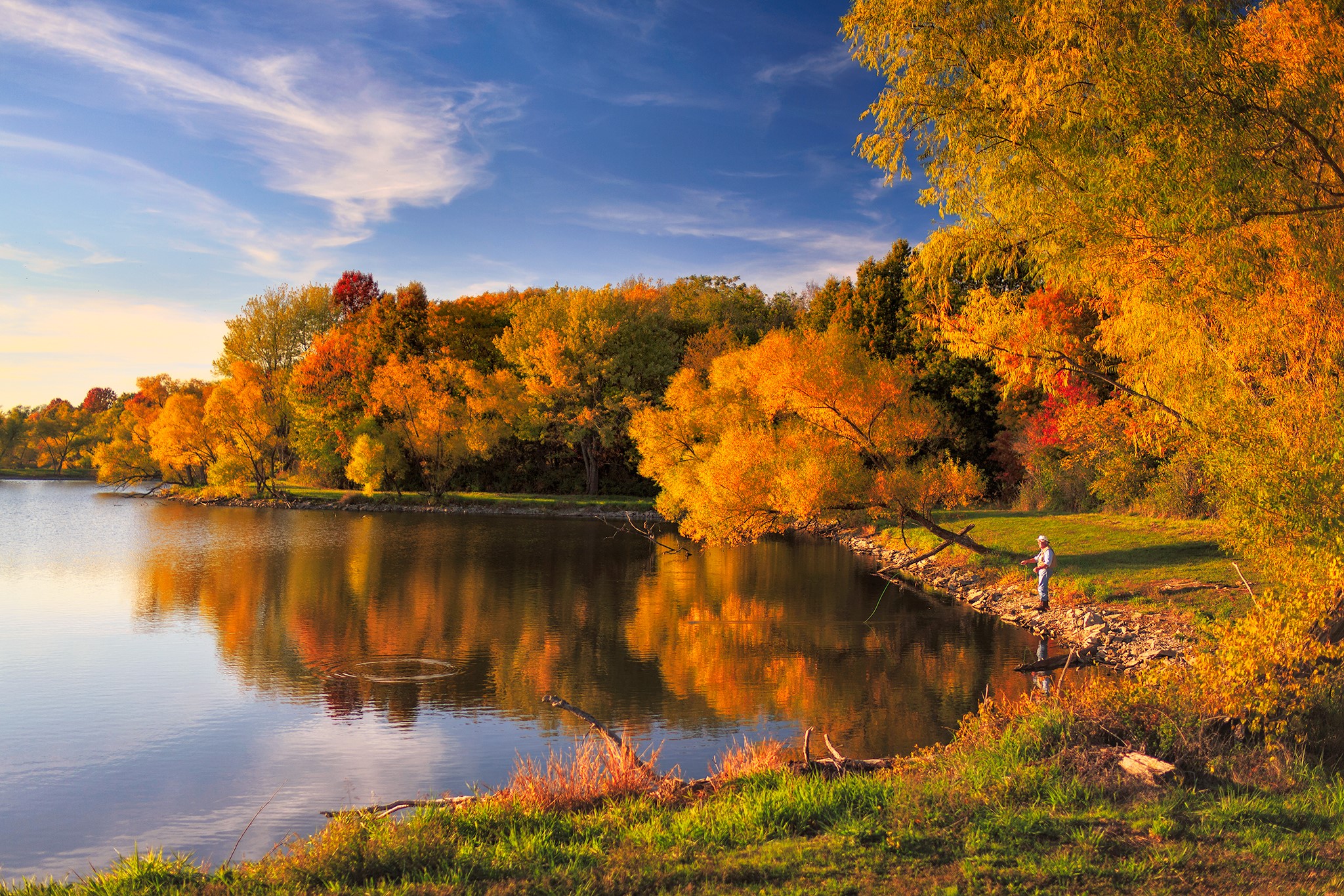 Fisherman by a lake during autumn HD Wallpaper