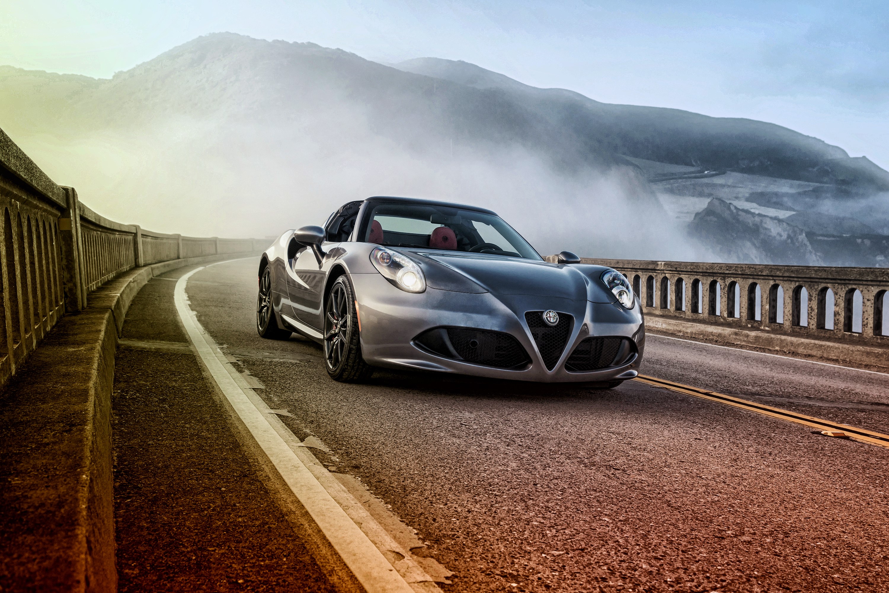 Alfa Romeo 4C Spider on a coastal road HD Wallpaper