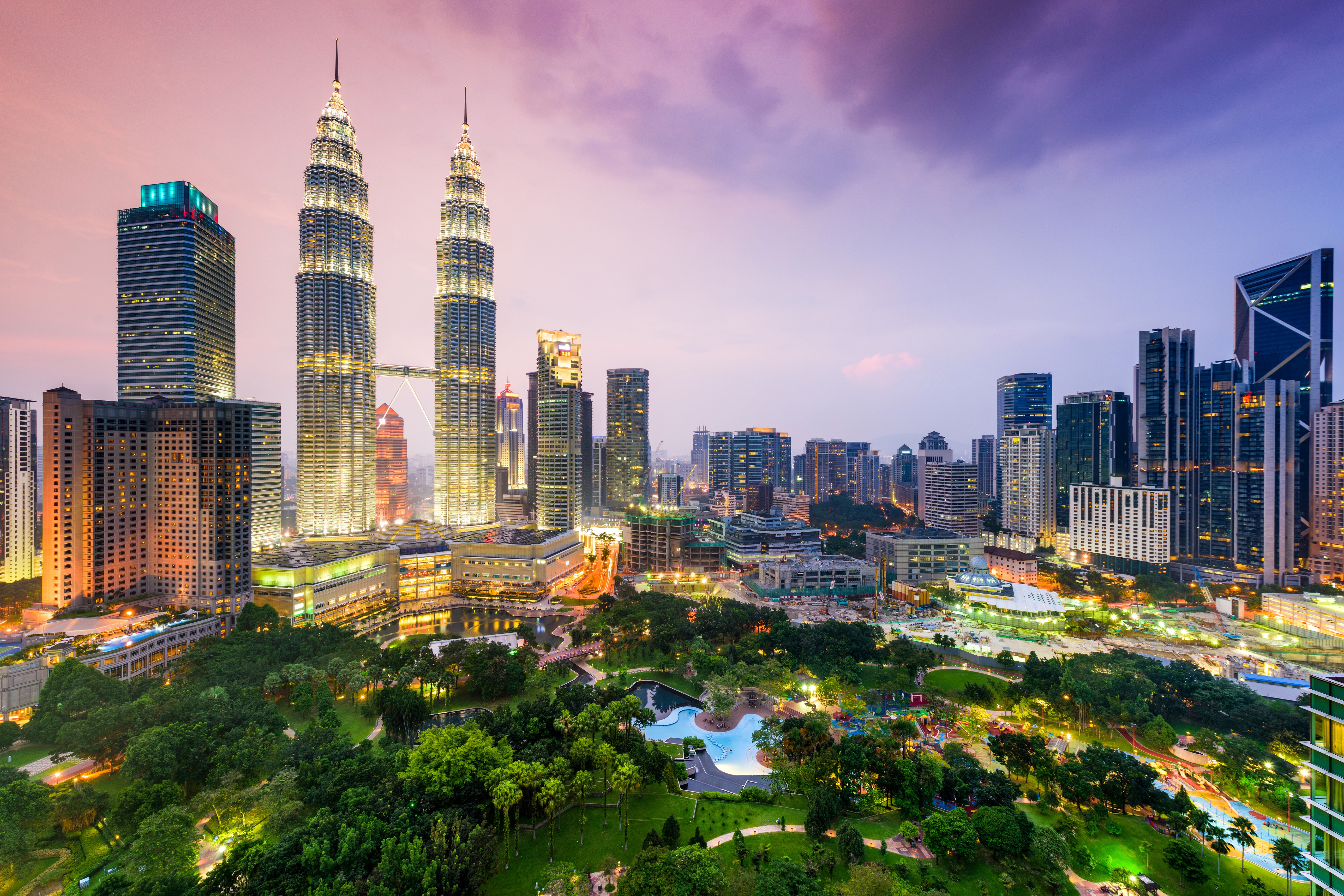 Kuala Lumpur skyline with Petronas Towers at night HD Wallpaper