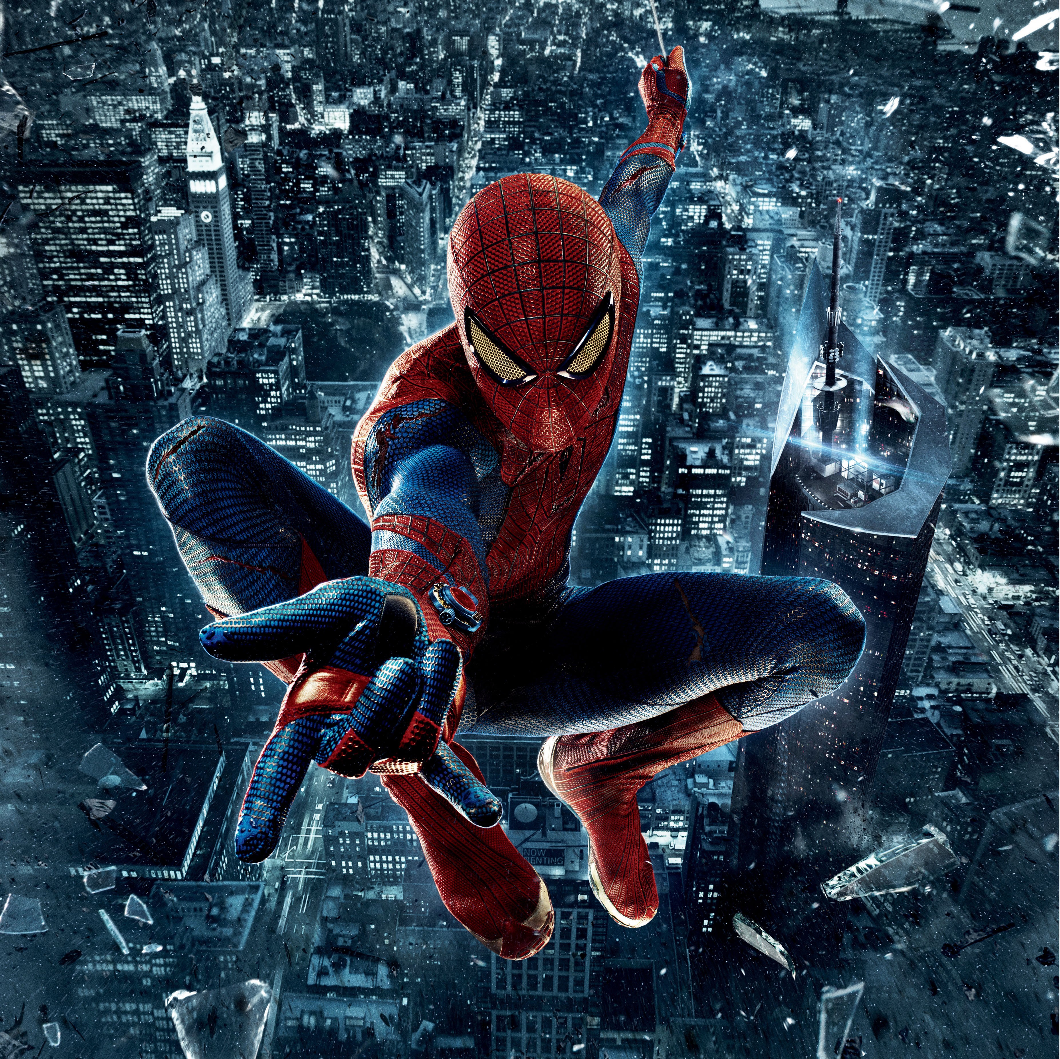 Spider-Man swinging over a city at night HD Wallpaper