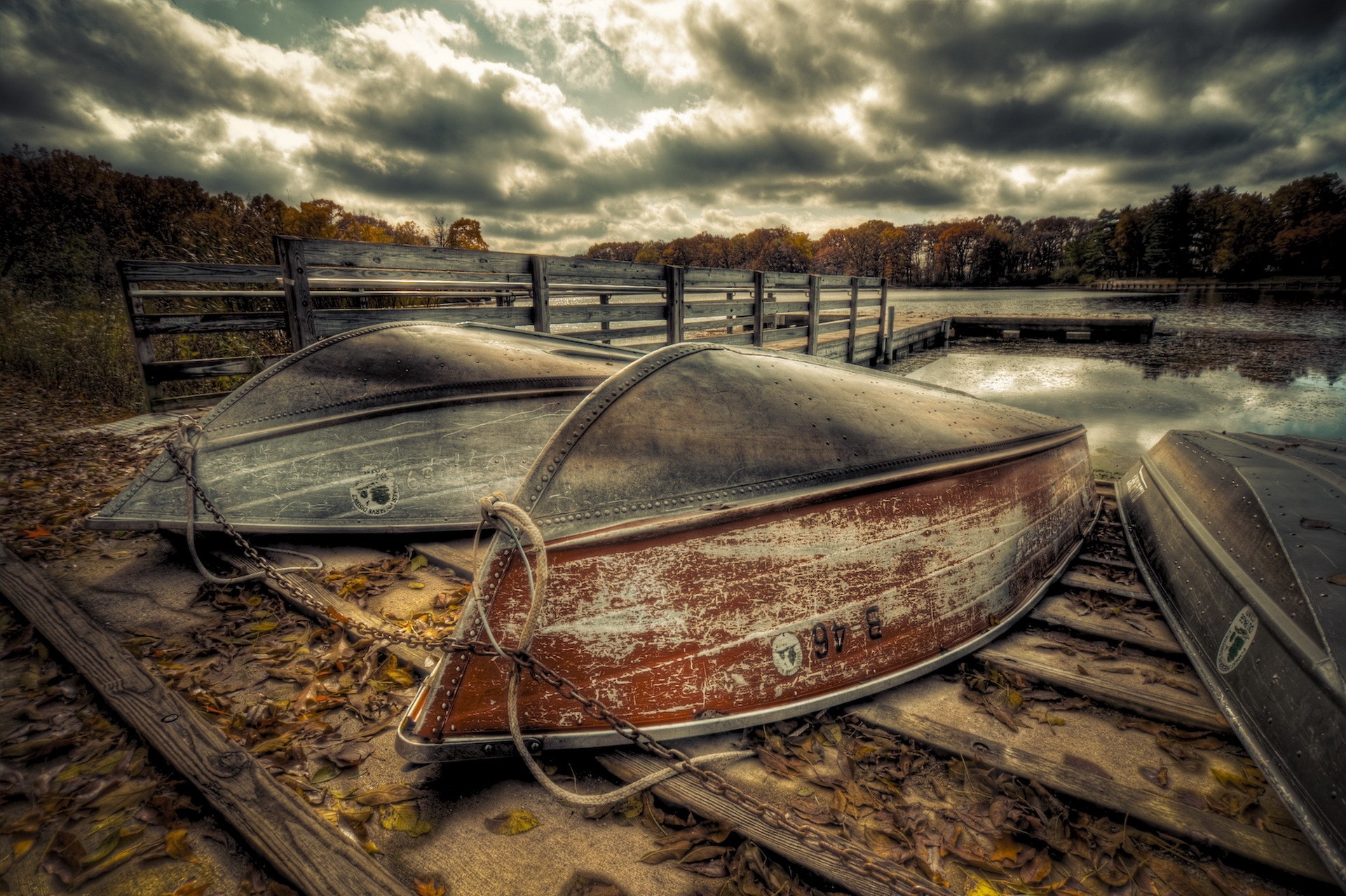 Boats on a Dock with Autumn Trees and Cloudy Sky HD Wallpaper