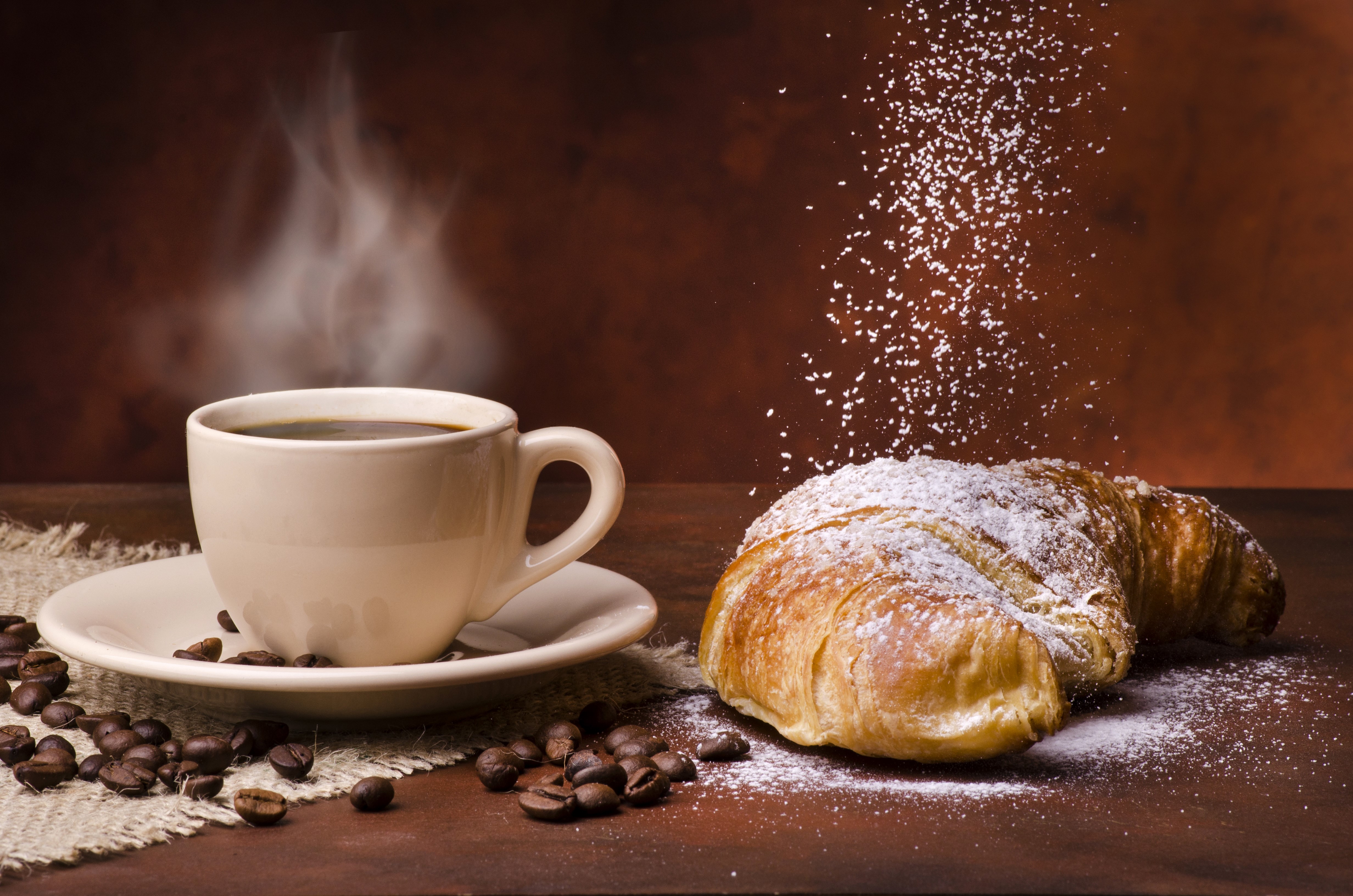 Coffee cup and croissant with powdered sugar HD Wallpaper