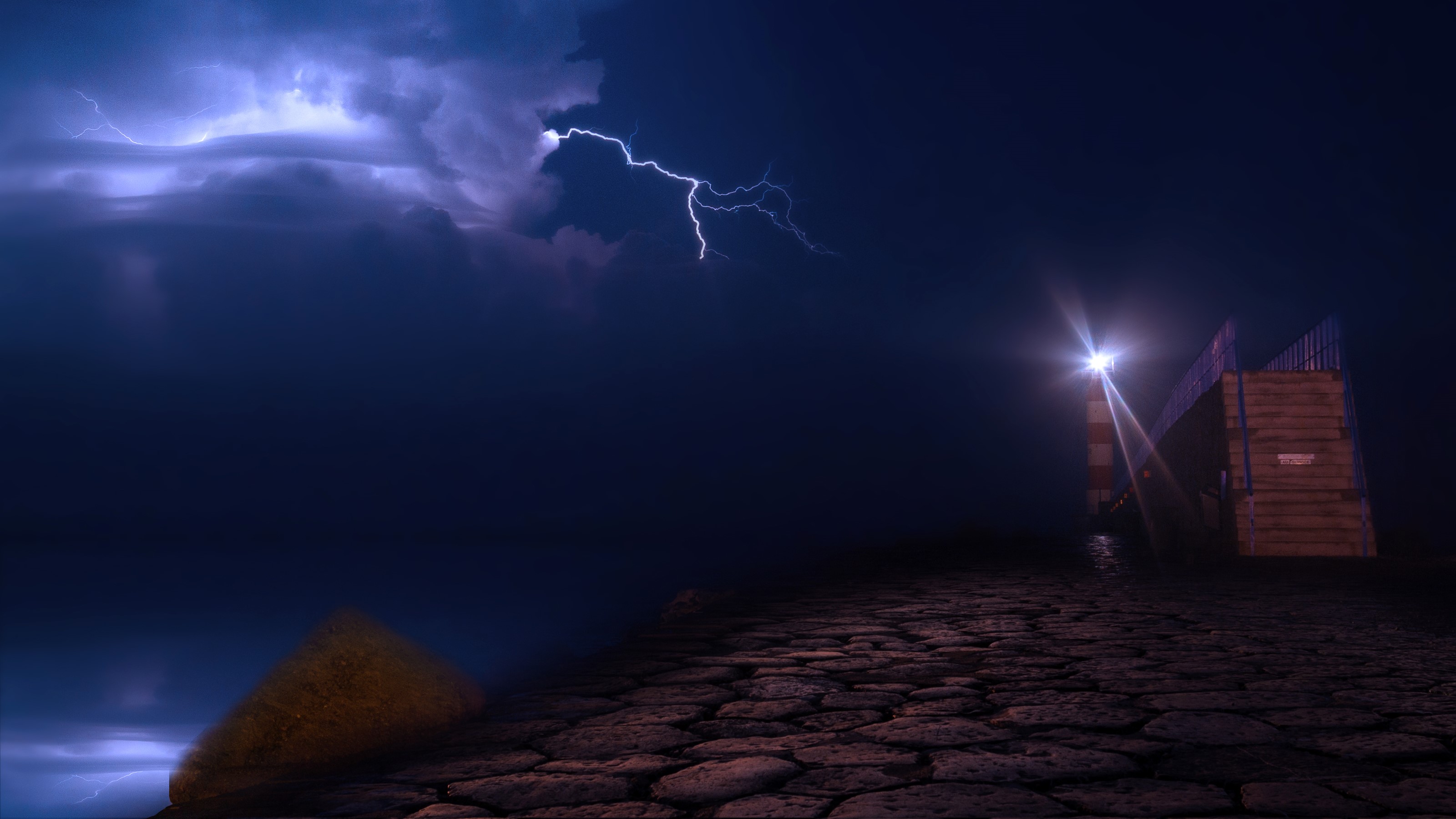 Lightning storm over Port la Nouvelle lighthouse at night HD Wallpaper