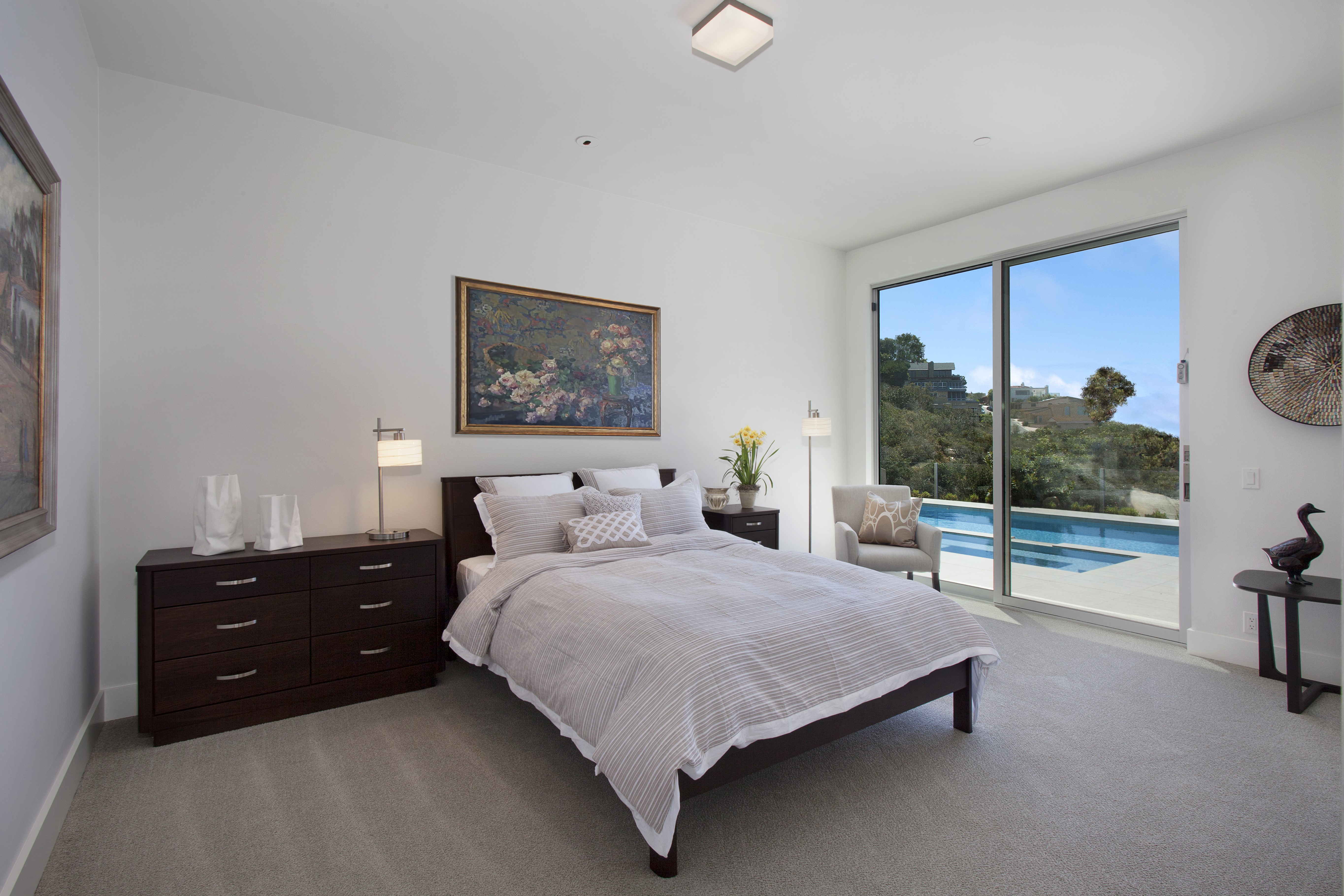 Bedroom with a view of a pool and hills HD Wallpaper