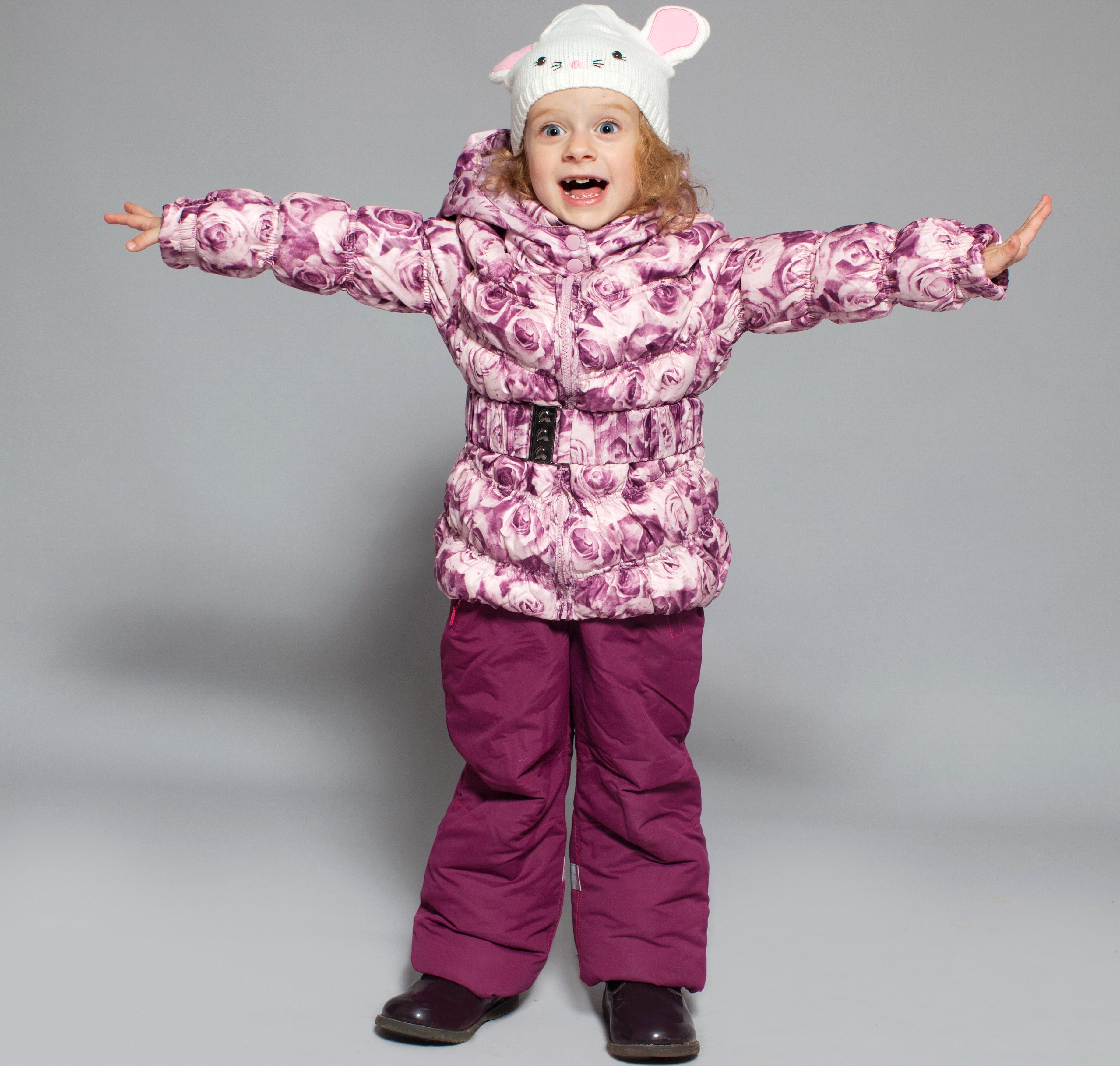 Girl in a floral winter jacket and hat HD Wallpaper