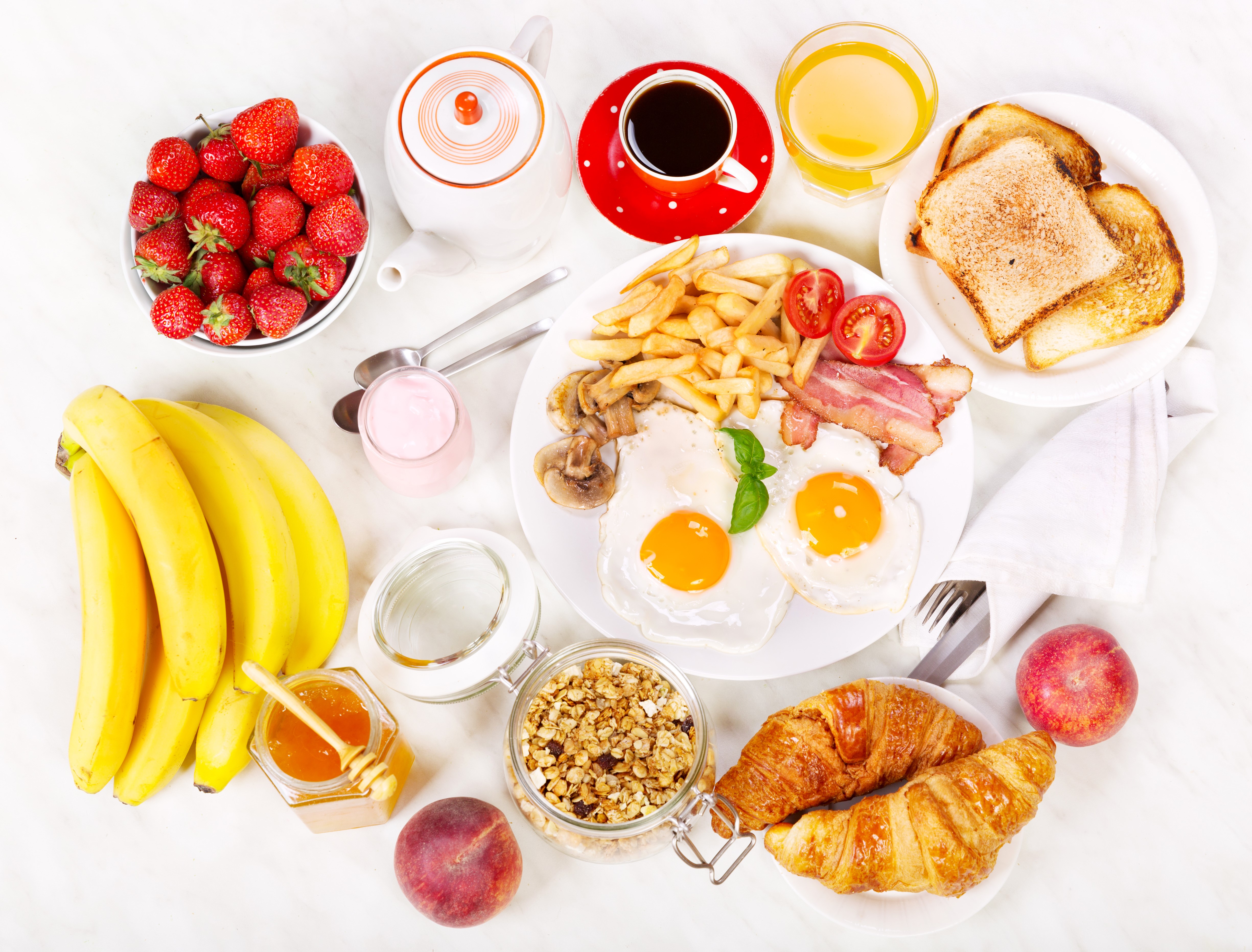 Breakfast with eggs, bacon, fries, toast, croissants, fruit, and coffee HD Wallpaper
