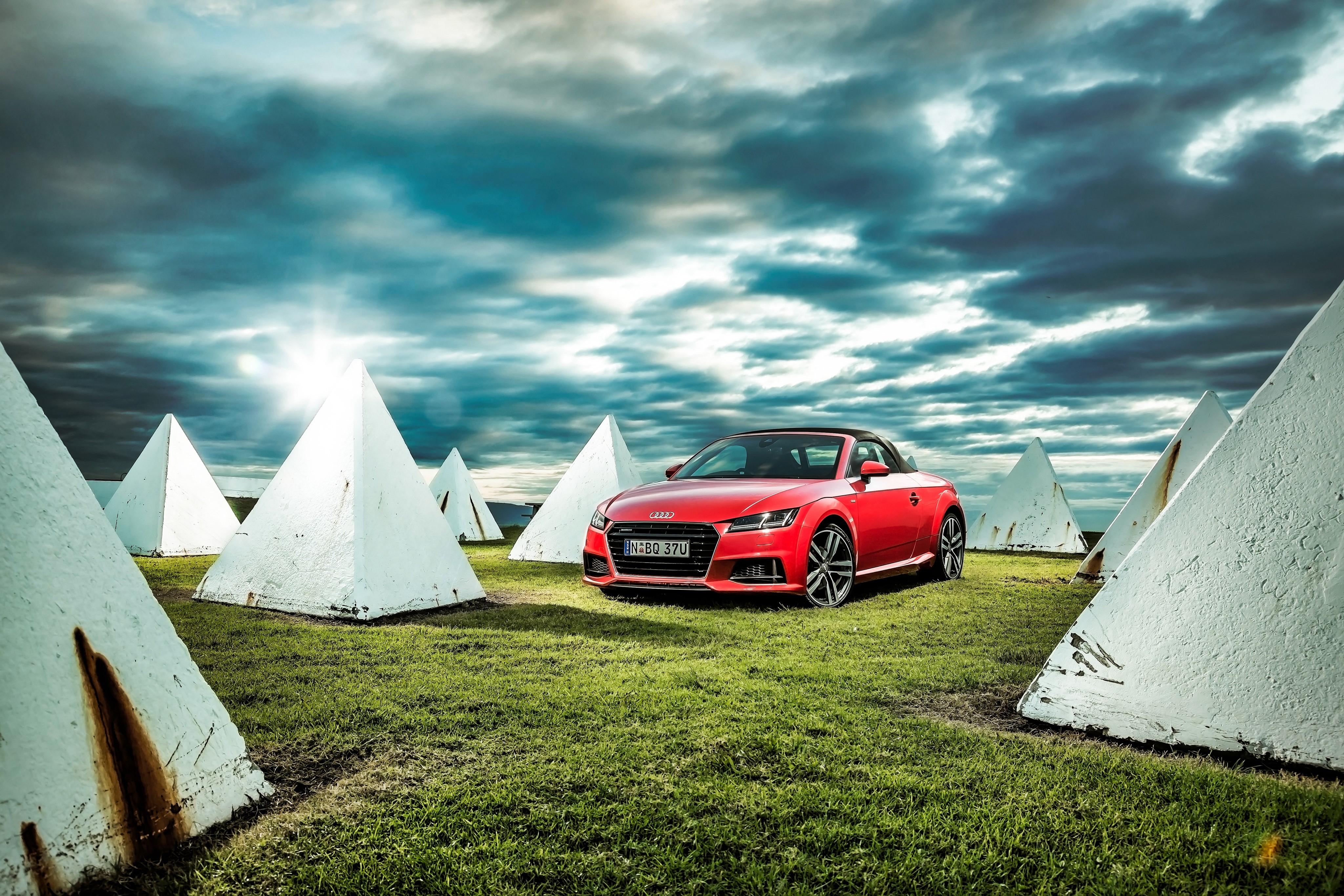 Red Audi TT Roadster among white pyramids HD Wallpaper
