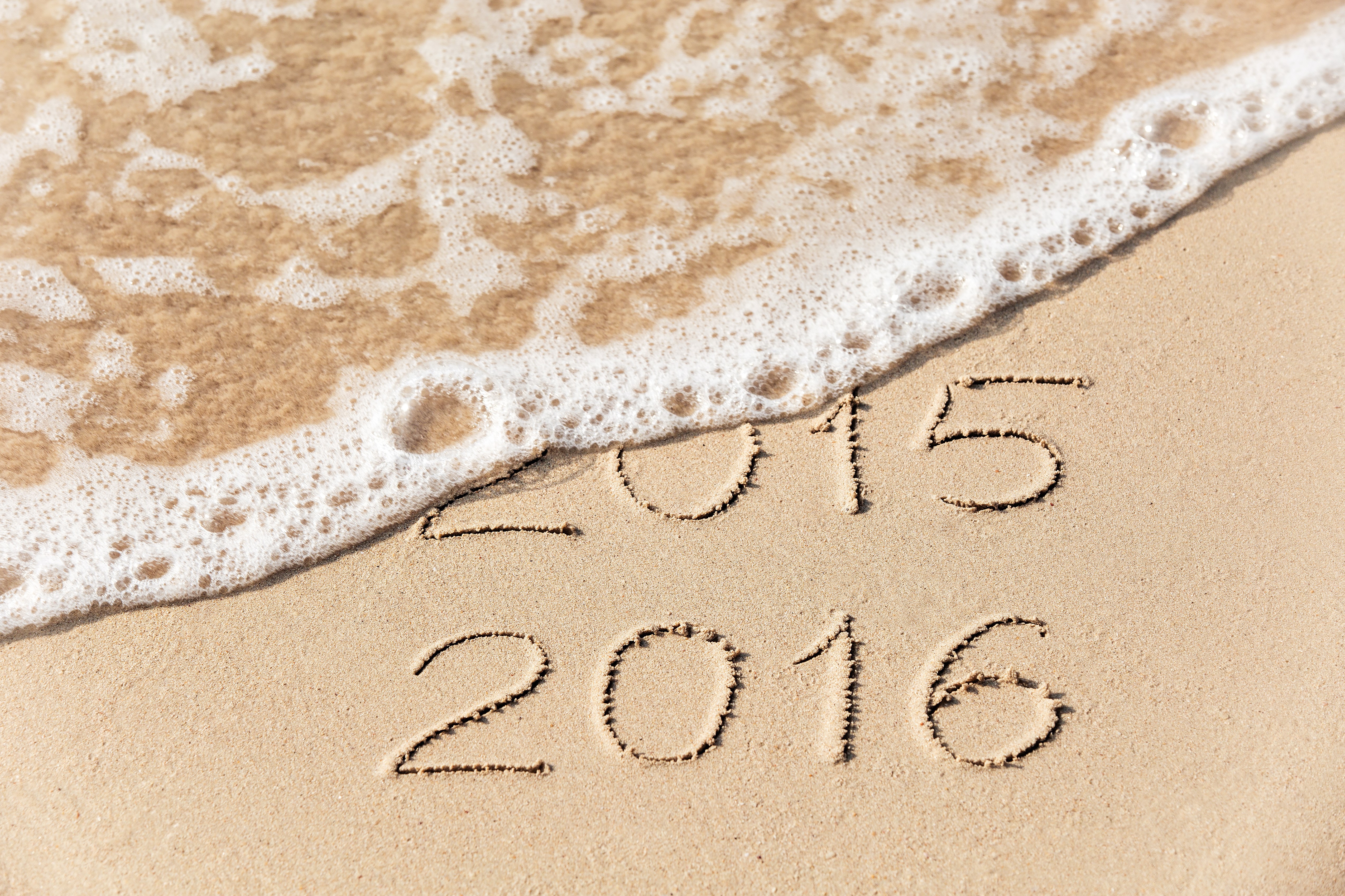 2015 and 2016 written in sand with waves HD Wallpaper