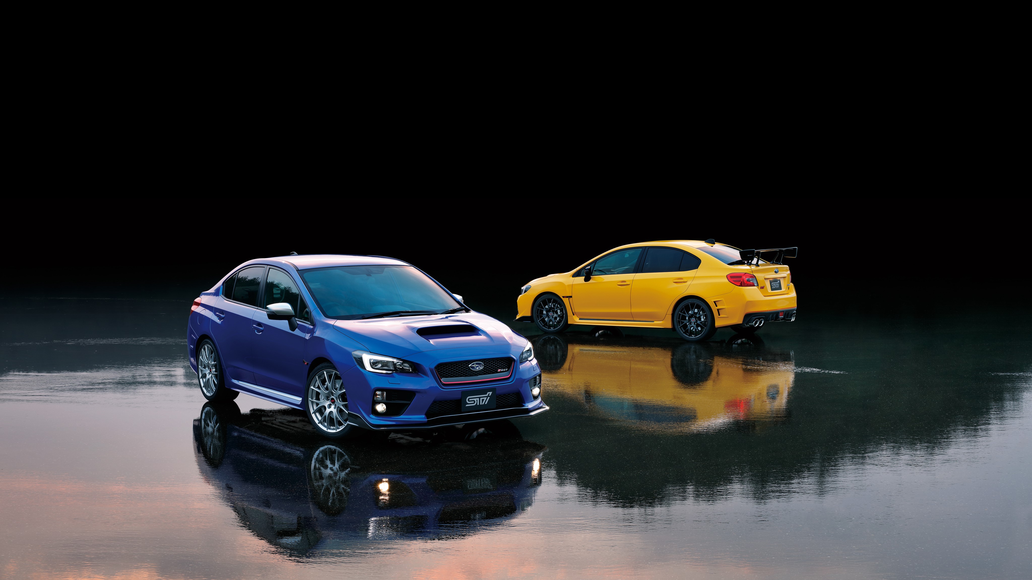 Two Subaru WRX STI cars HD Wallpaper