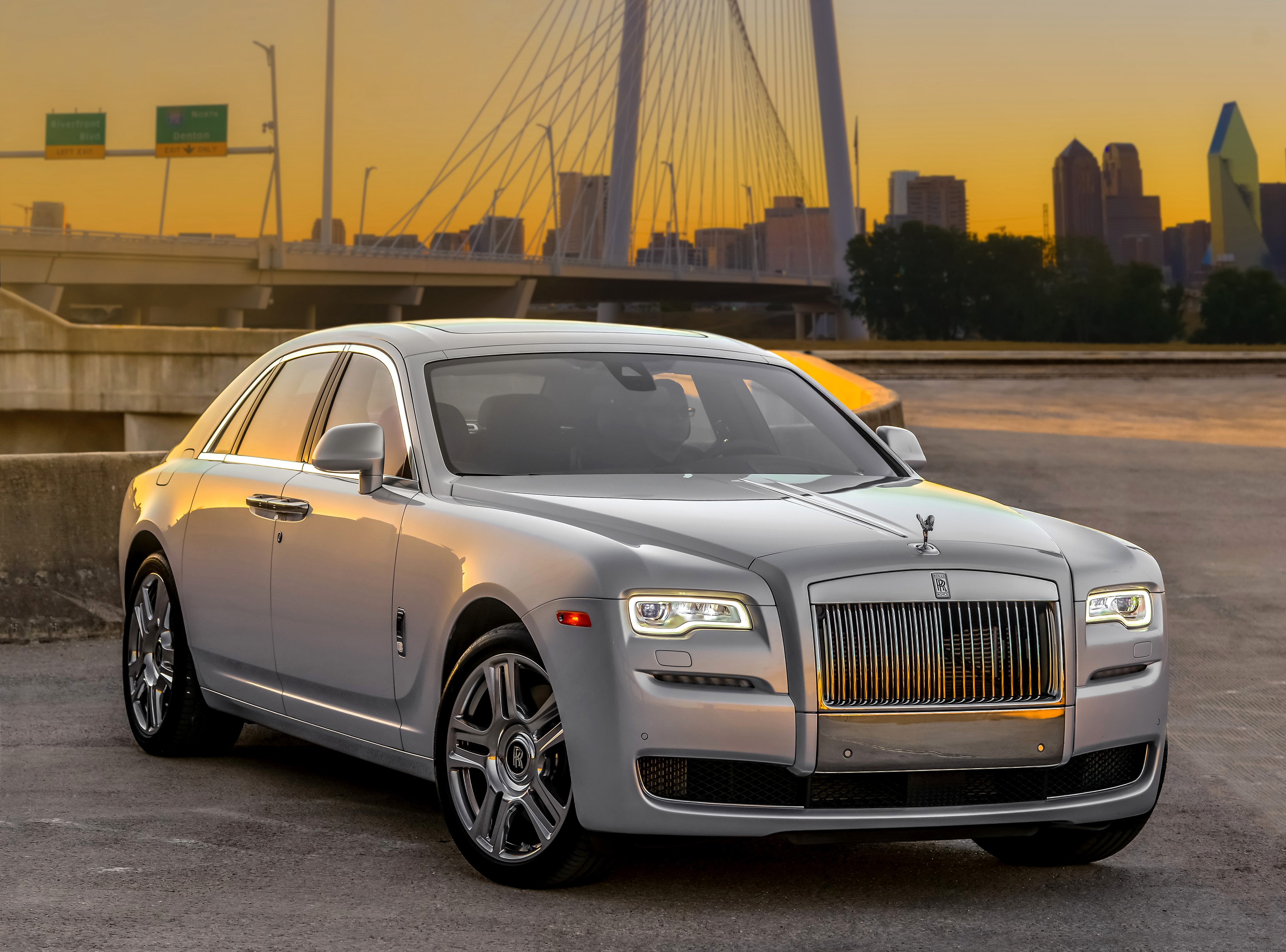 Rolls-Royce Ghost sedan on a bridge at sunset HD Wallpaper