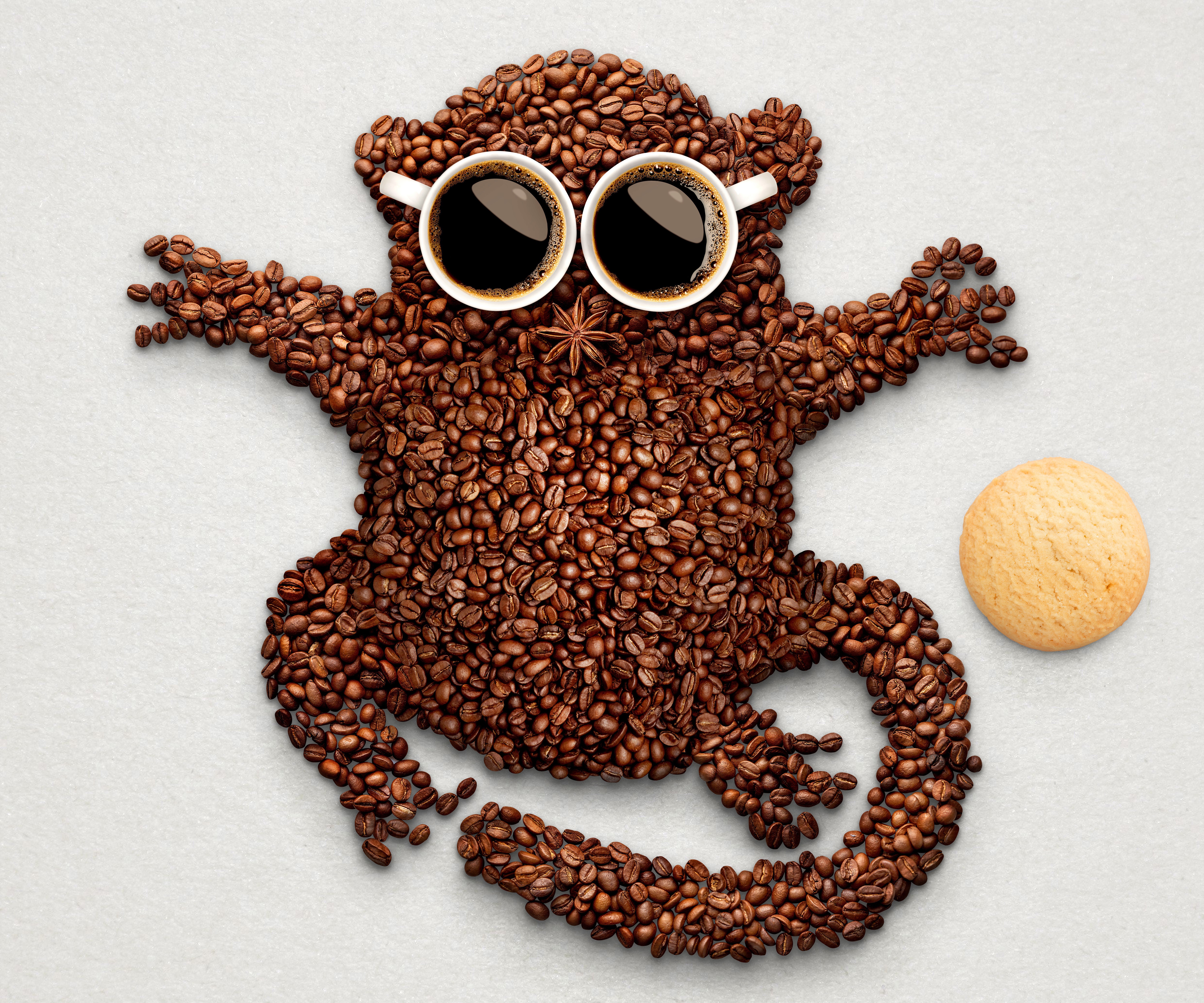 Monkey made of coffee beans with coffee cups for eyes HD Wallpaper