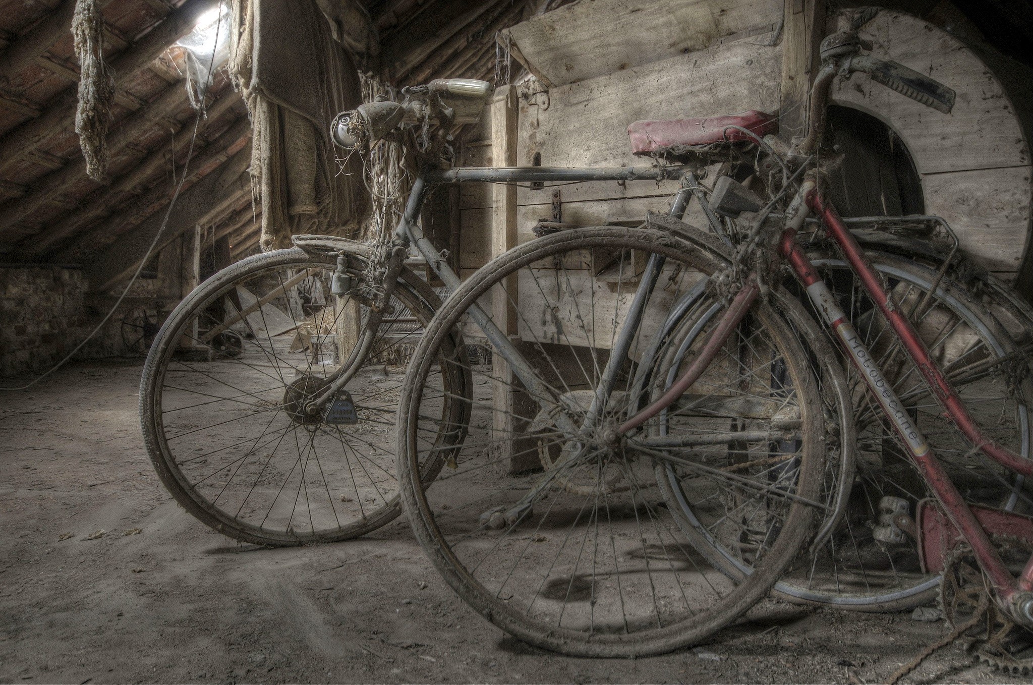 Two old bicycles in a dusty attic HD Wallpaper