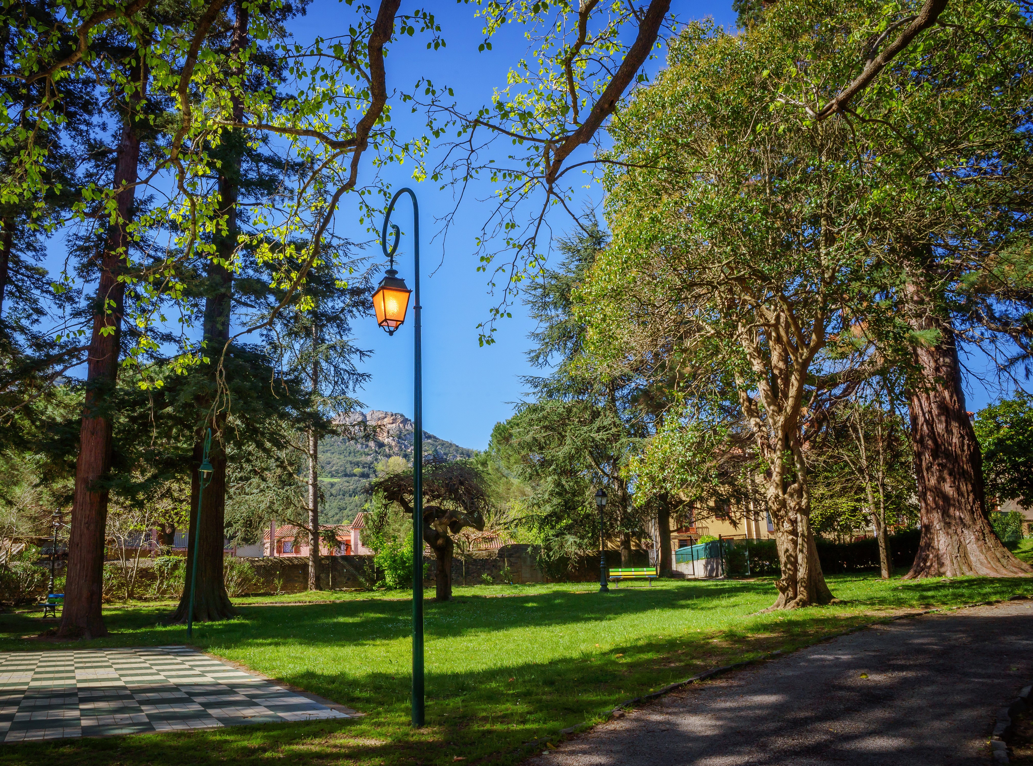 Park with Street Light in Arles-sur-Tech, France HD Wallpaper