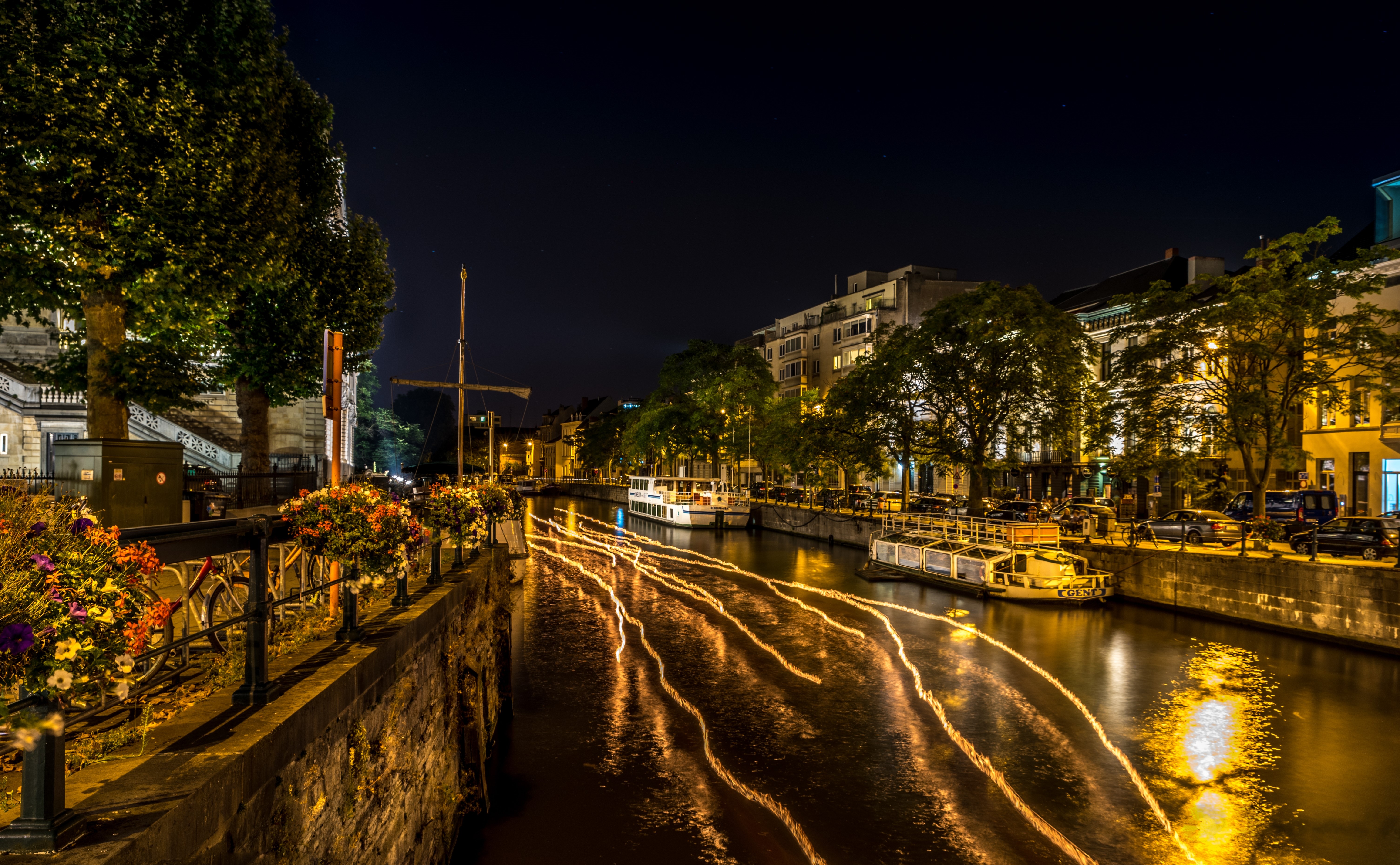 Night canal with boats and lights in Groningen HD Wallpaper