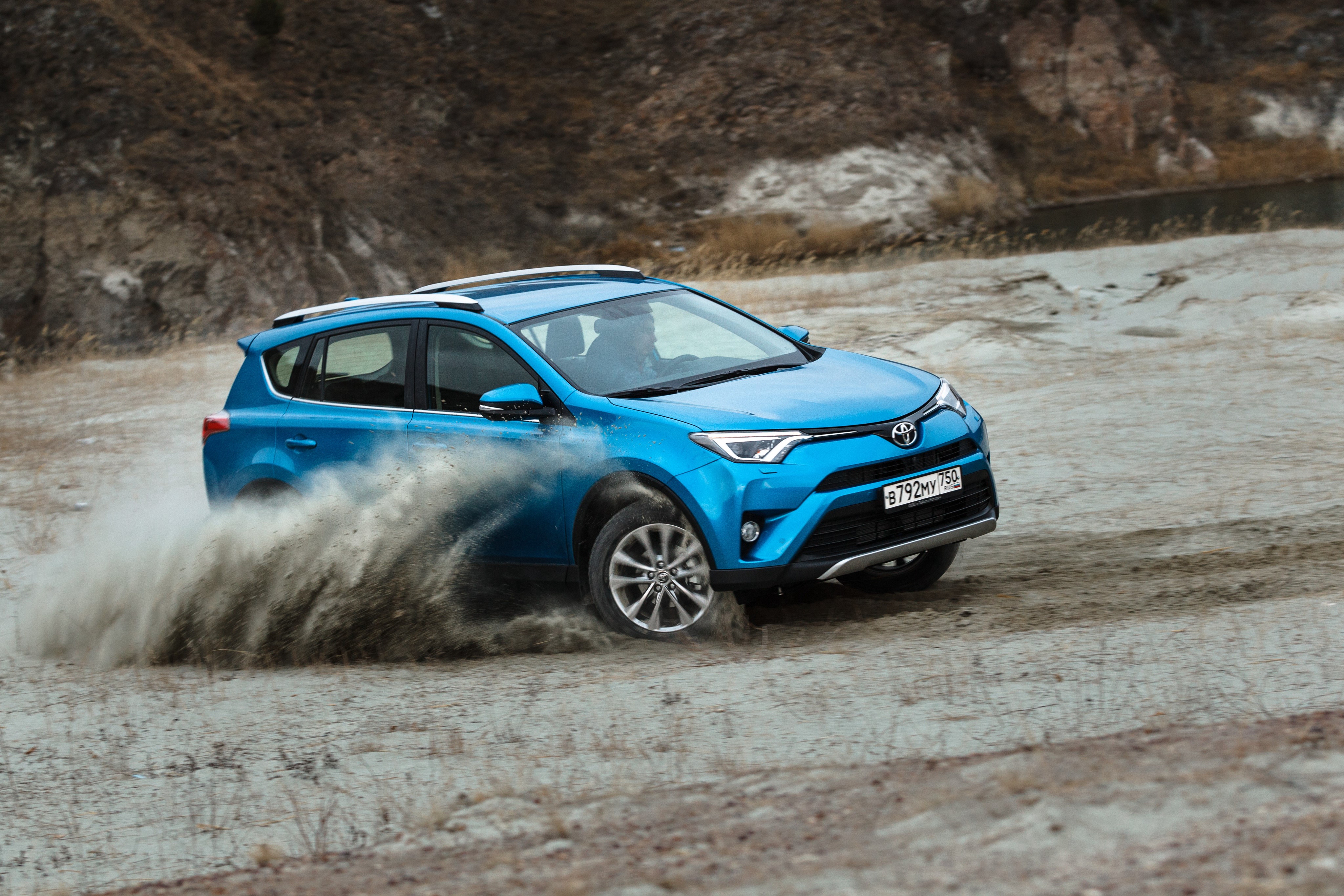 Blue Toyota RAV4 driving off-road HD Wallpaper