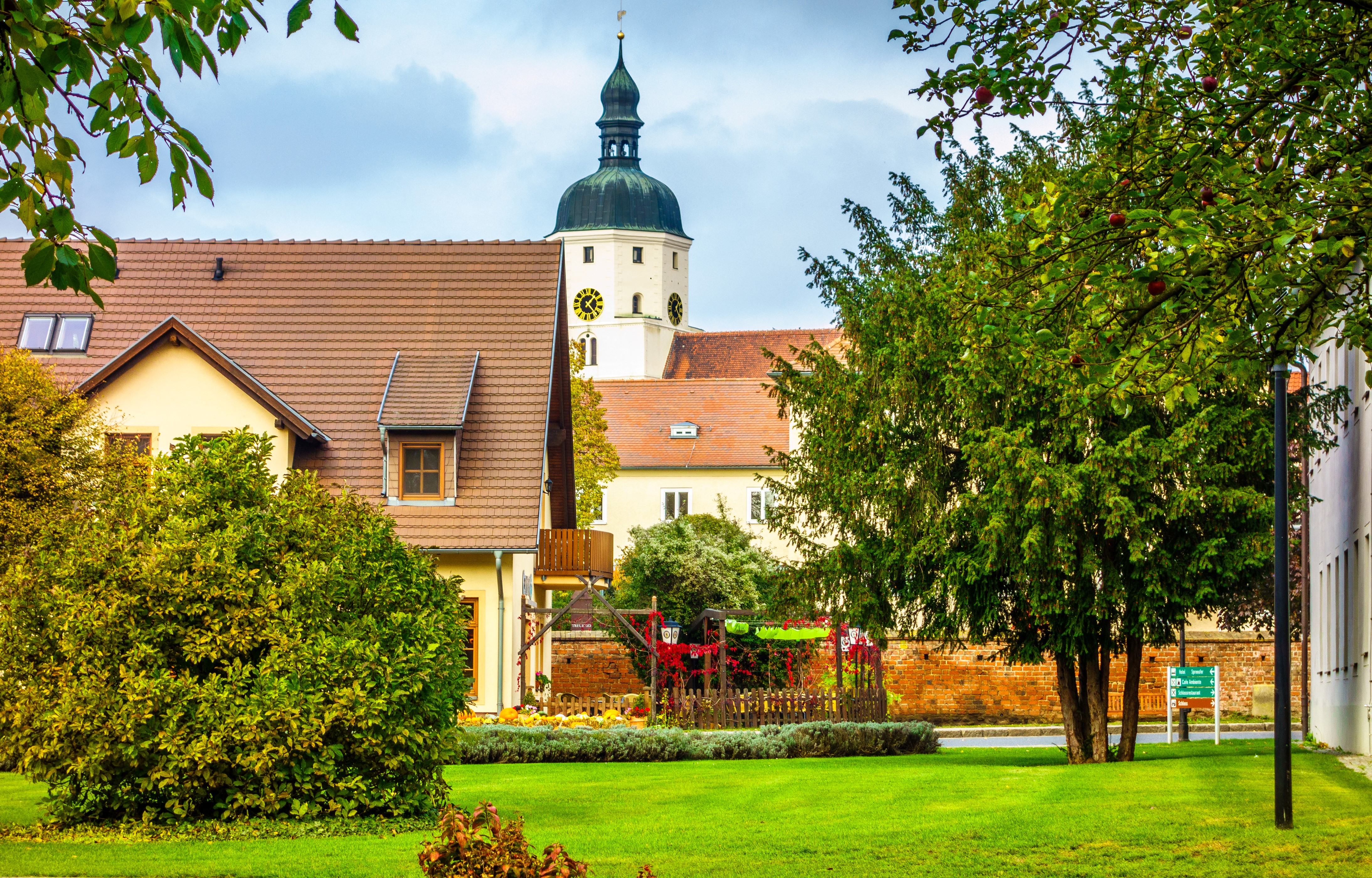 Houses and church tower in Germany HD Wallpaper