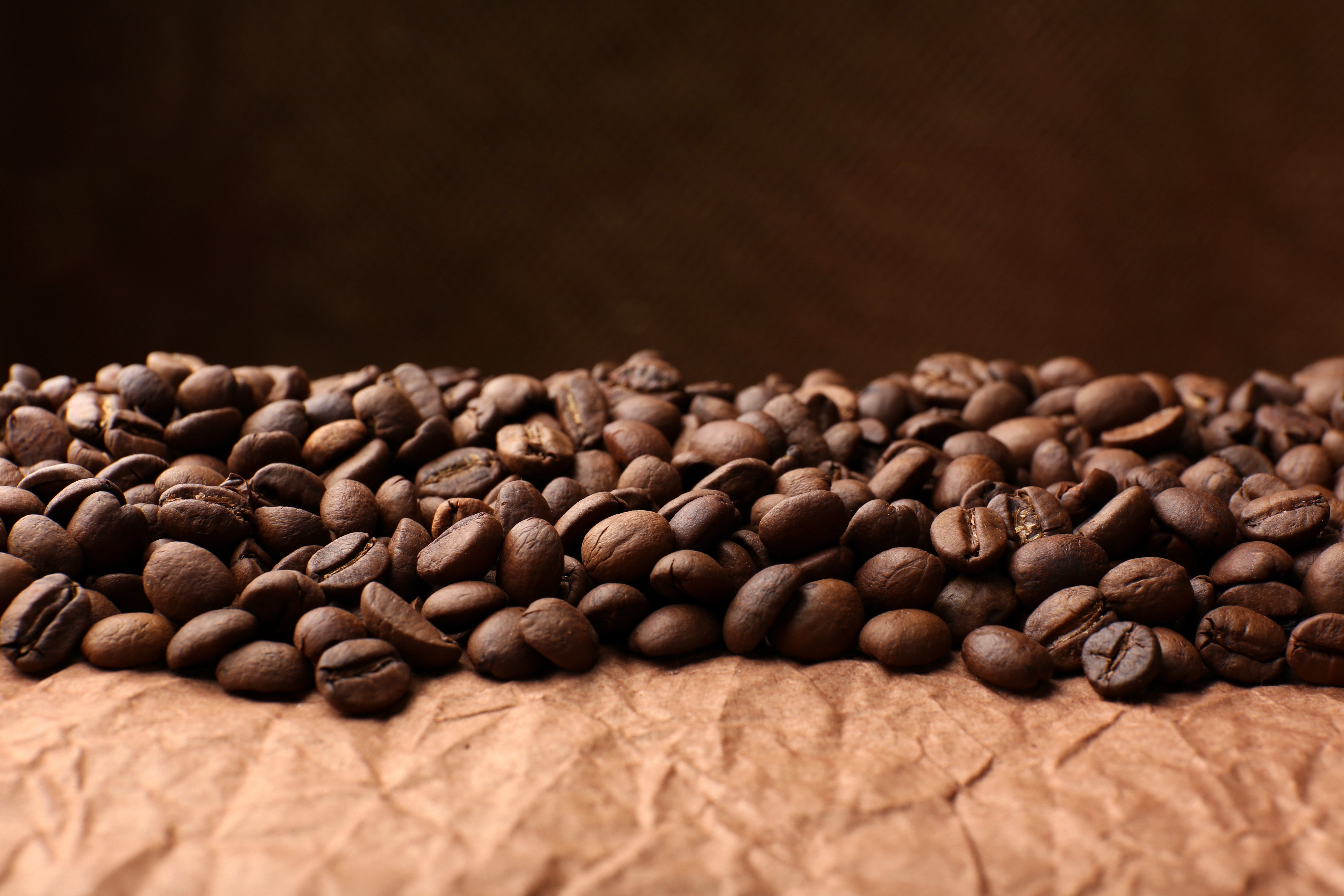Coffee beans on brown paper HD Wallpaper