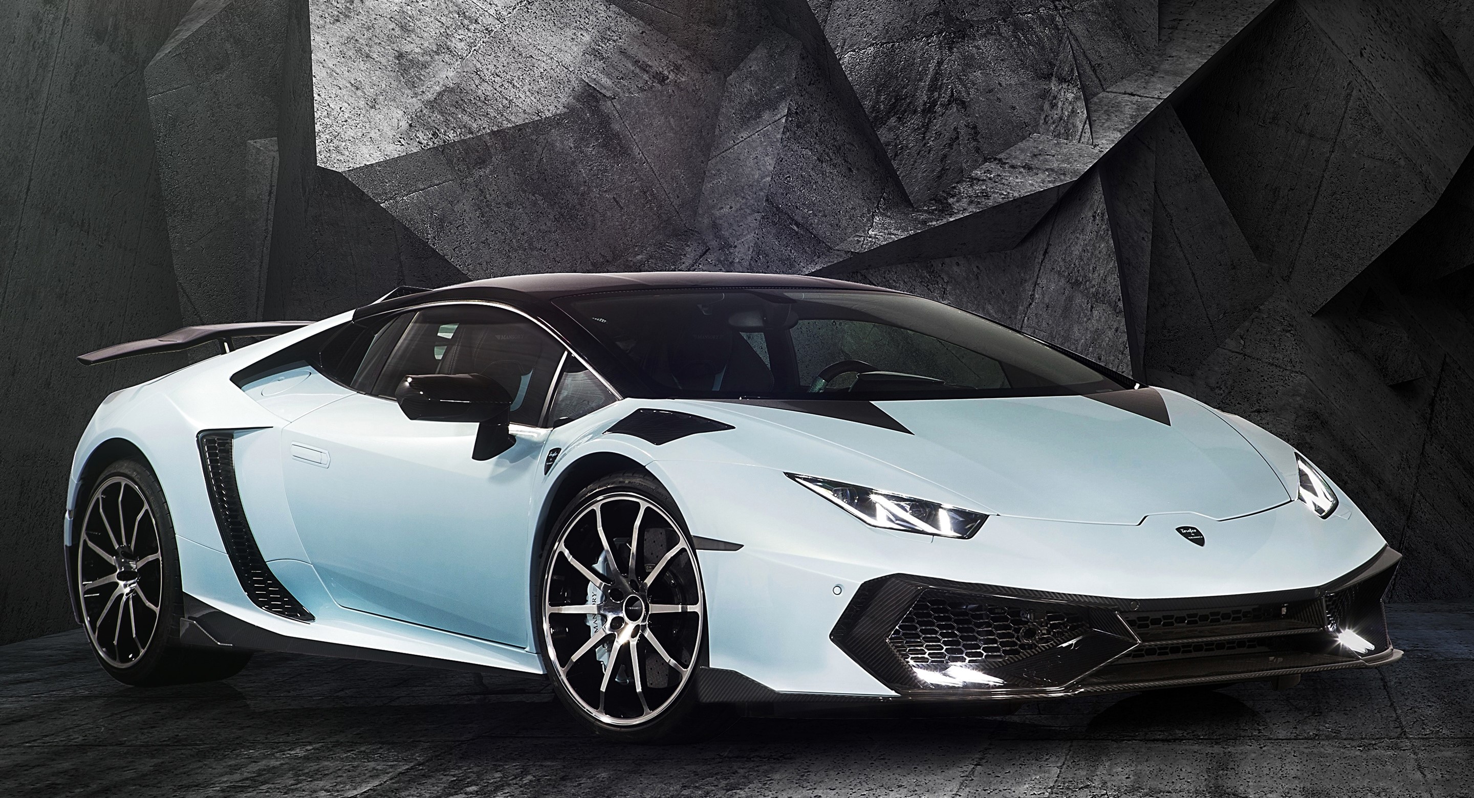 White Lamborghini sports car with black accents HD Wallpaper