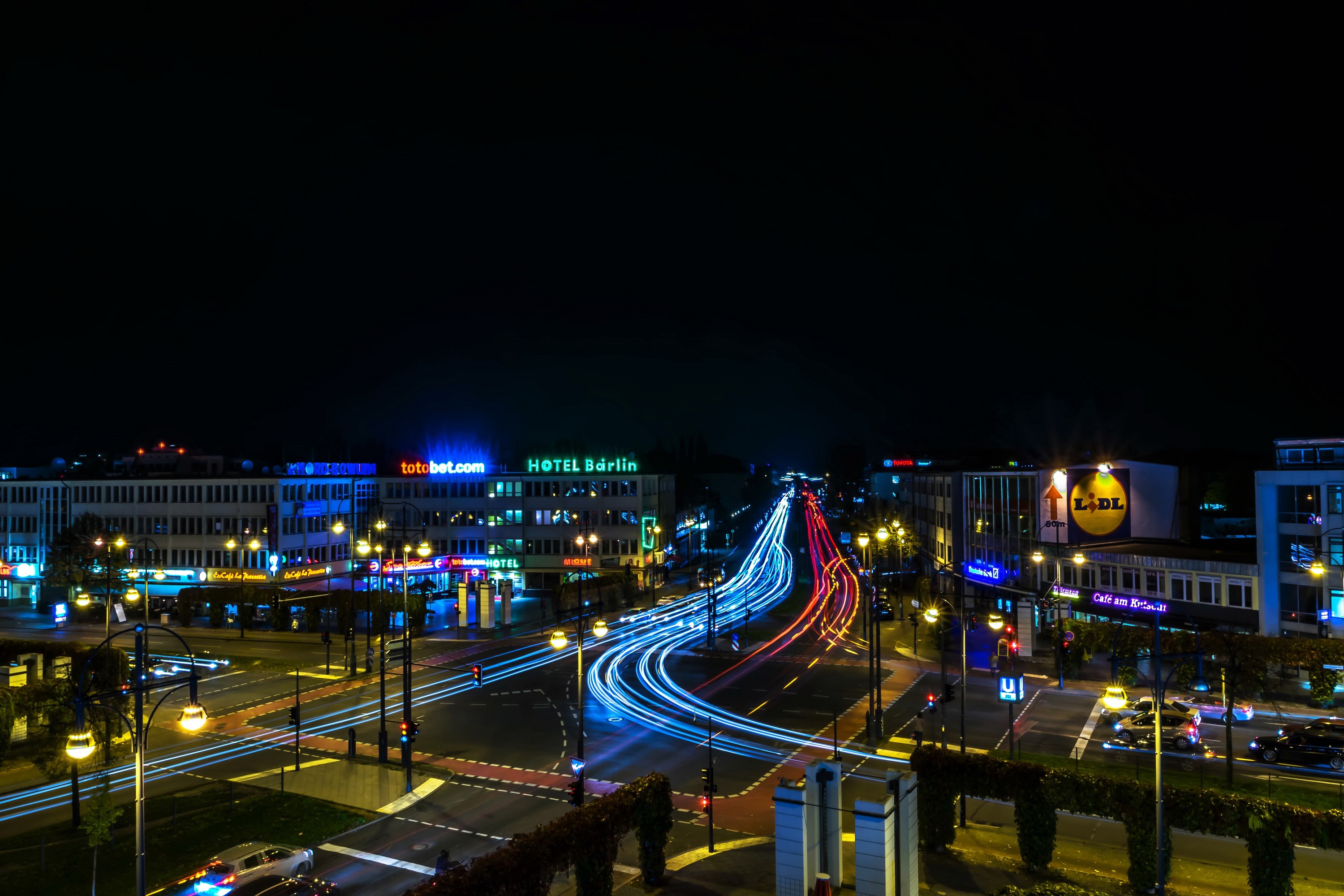 Nighttime cityscape with light trails in Berlin, Germany HD Wallpaper