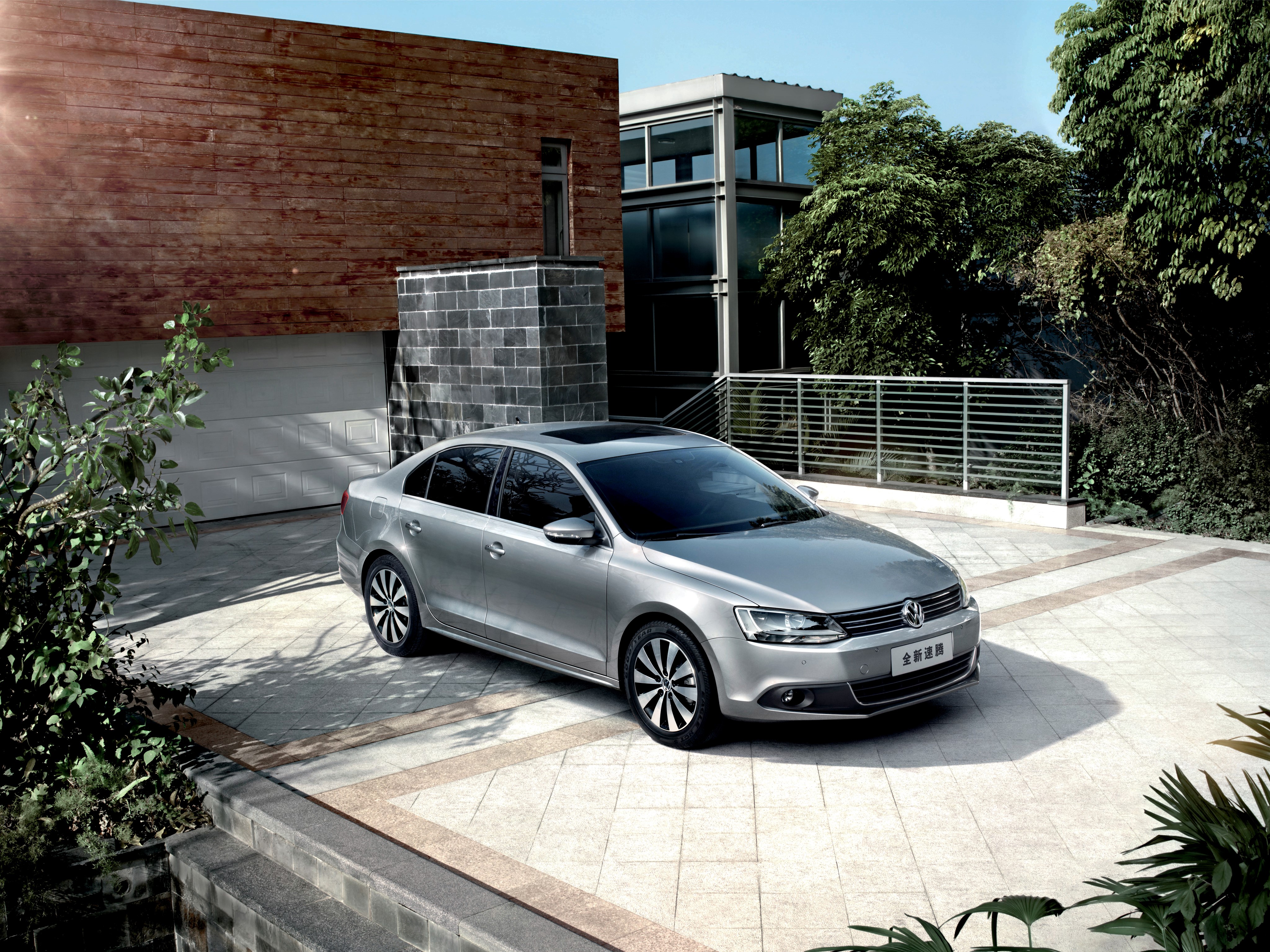 Silver Volkswagen Sagitar parked in driveway HD Wallpaper