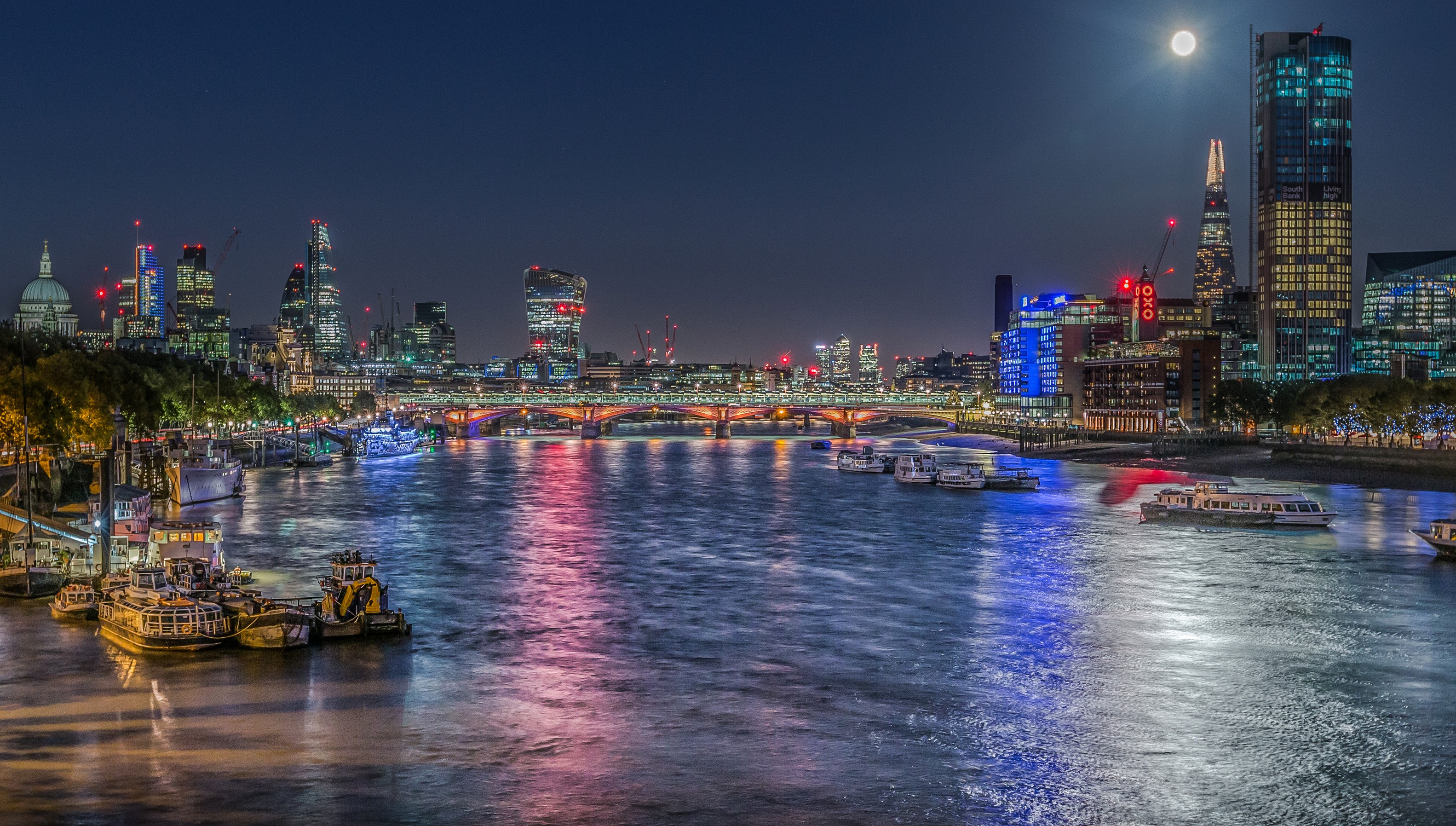London skyline at night with the River Thames and moon HD Wallpaper