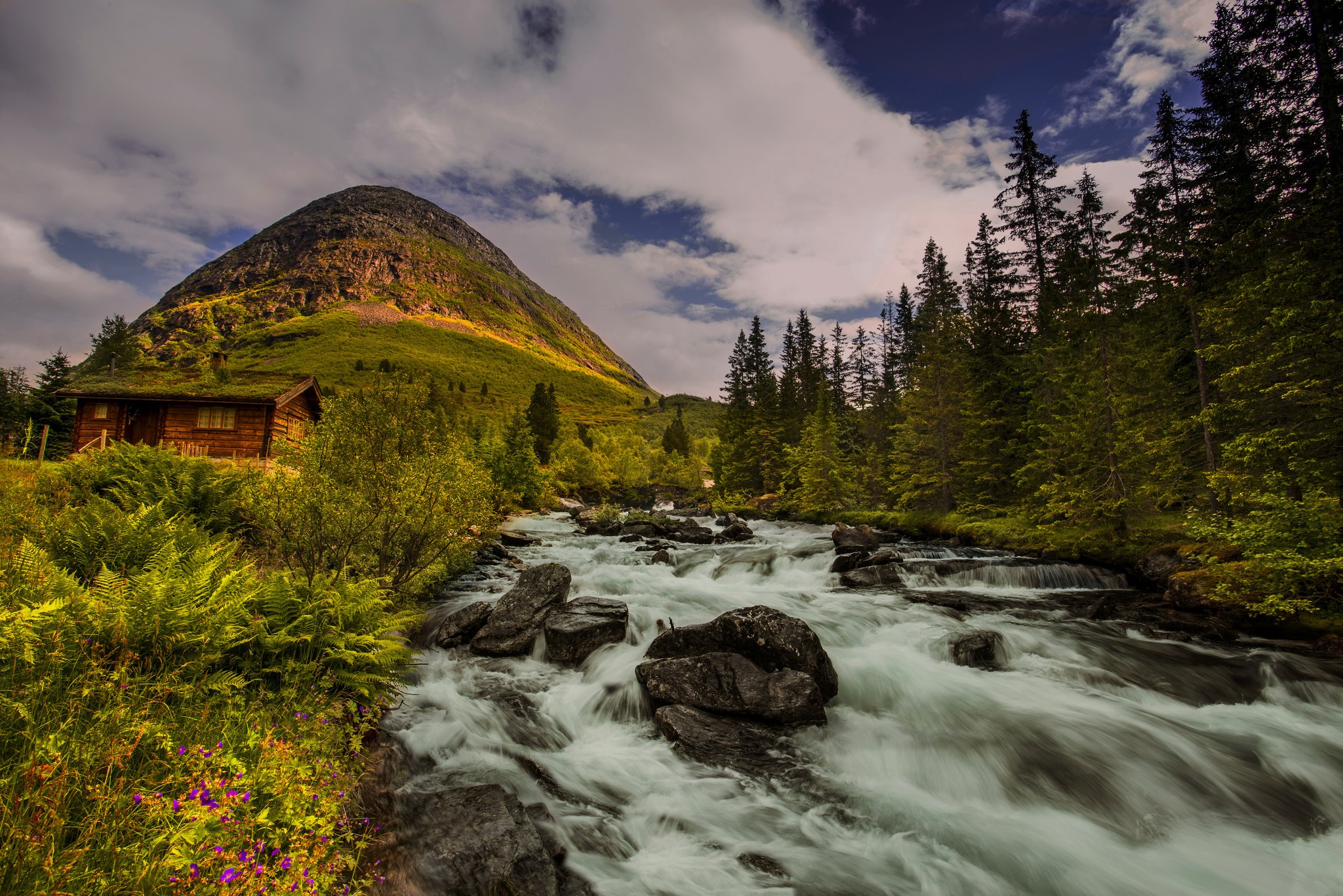 Wooden cabin by a mountain river in Norway HD Wallpaper
