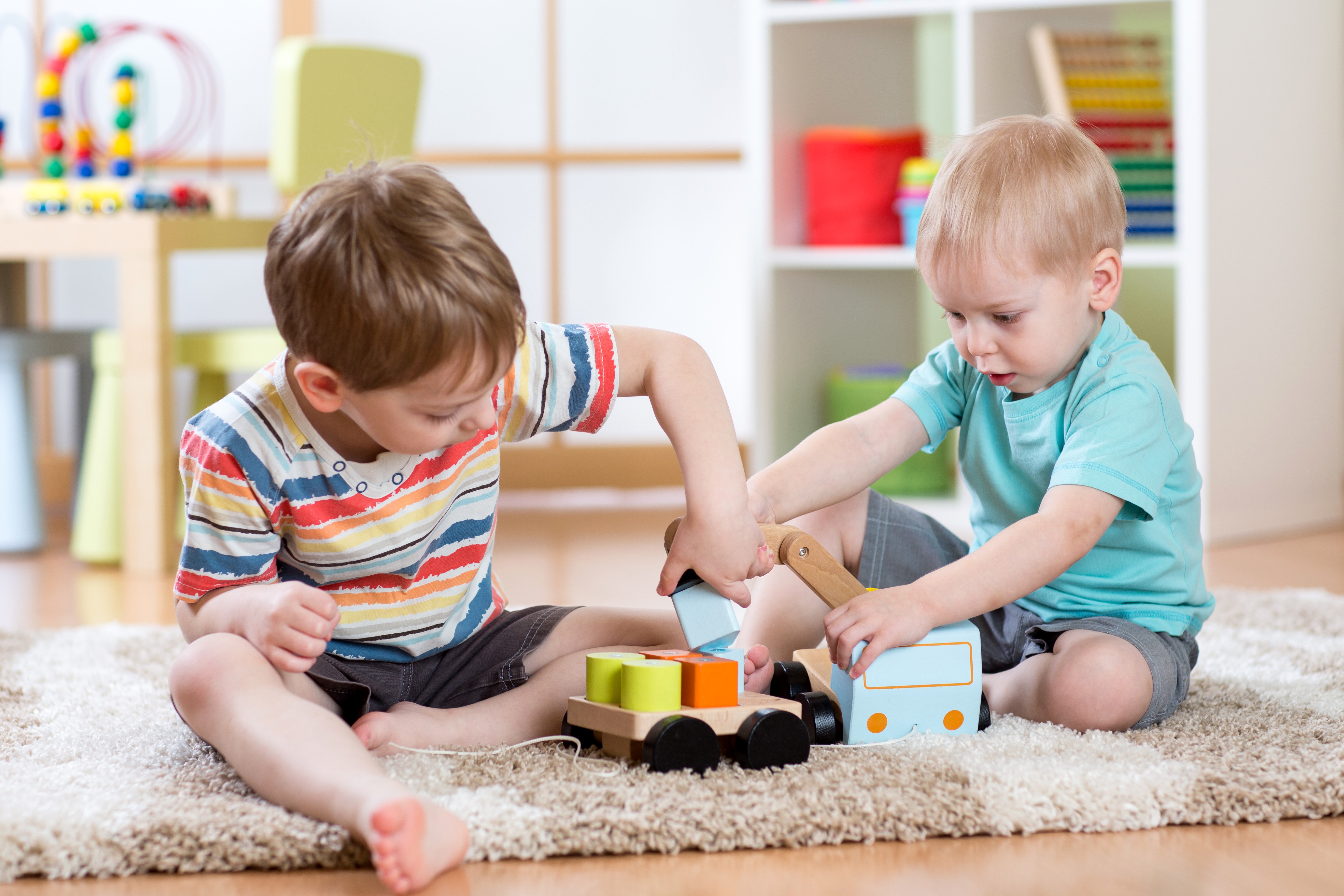 Two Boys Playing with Toys HD Wallpaper