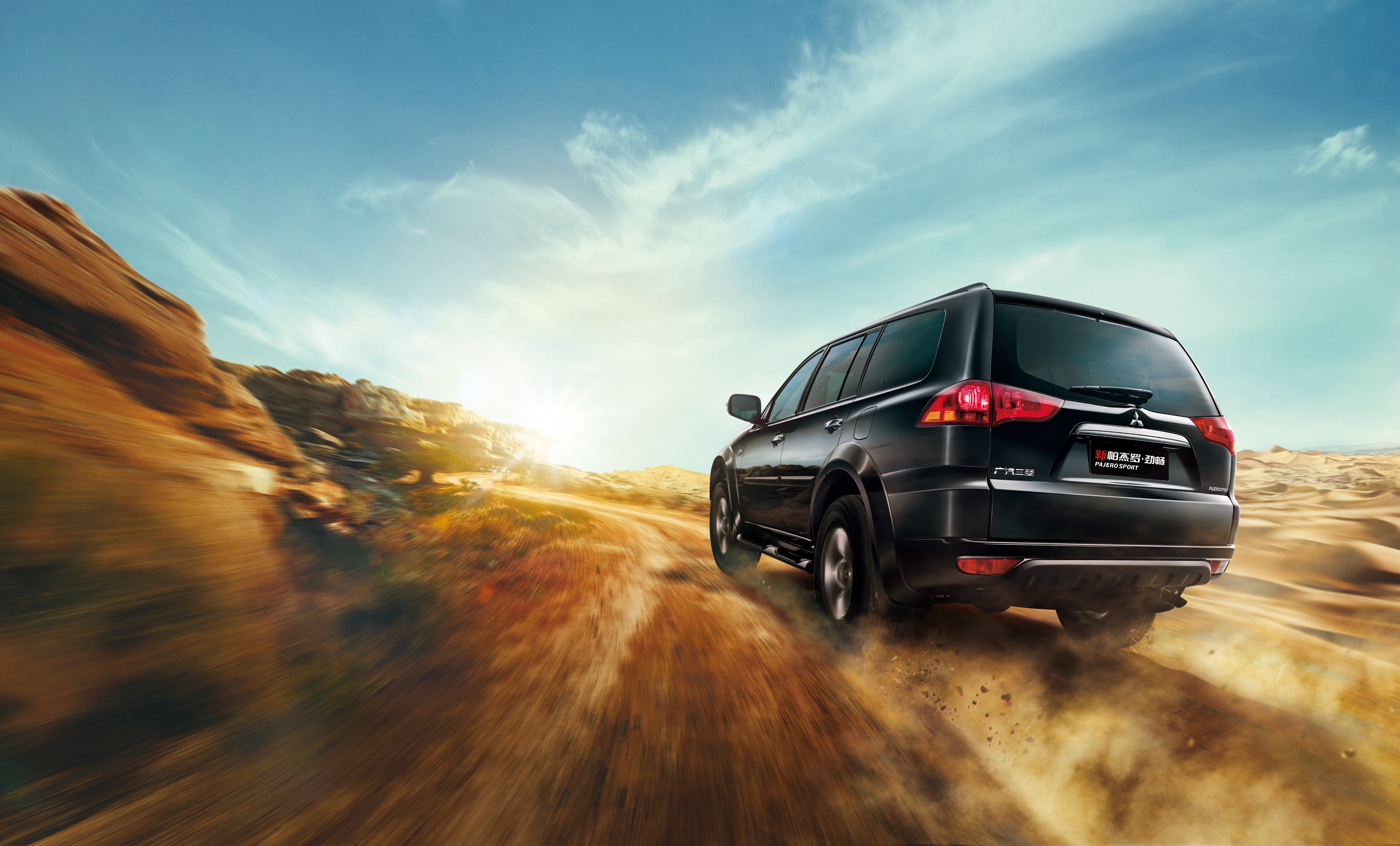 Black Mitsubishi Pajero driving on a desert road HD Wallpaper