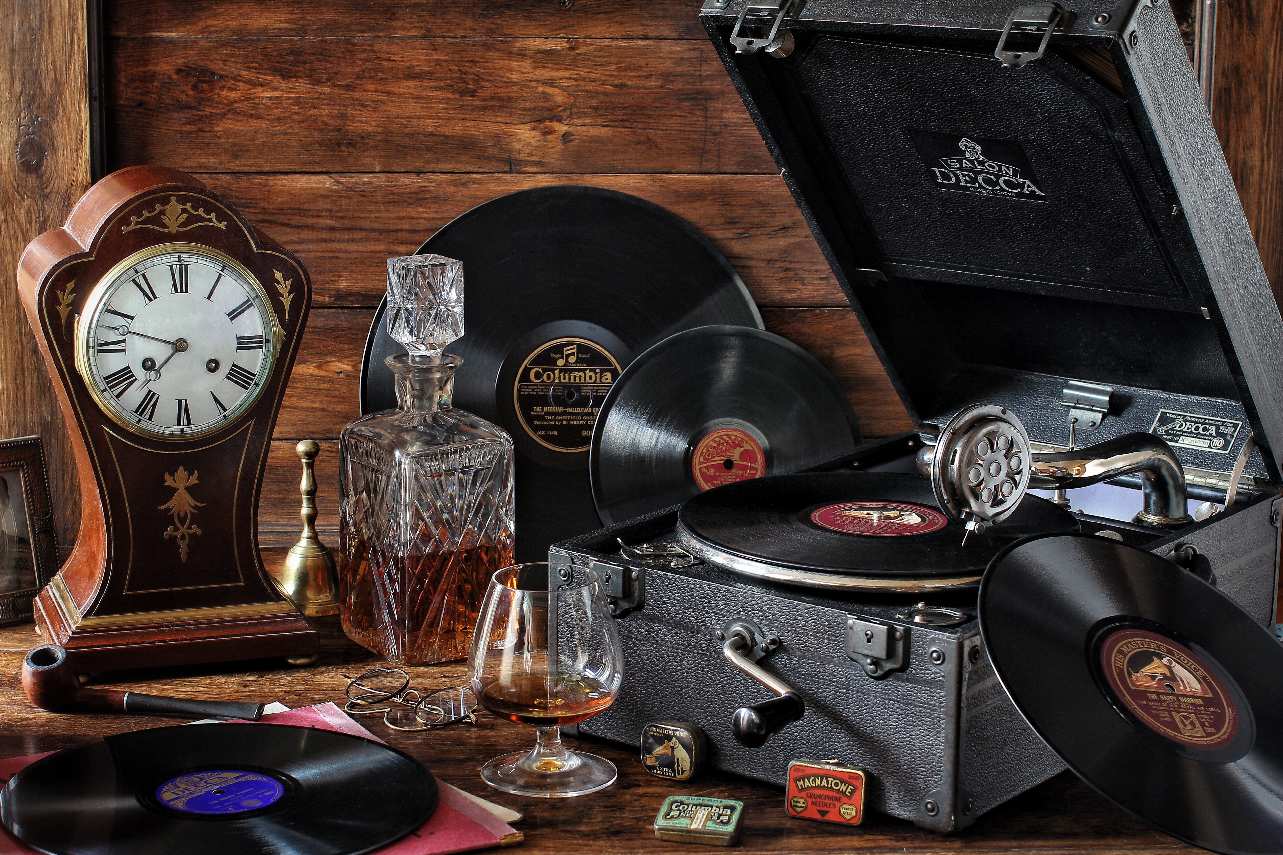 Still-life with gramophone records, clock, and decanter HD Wallpaper