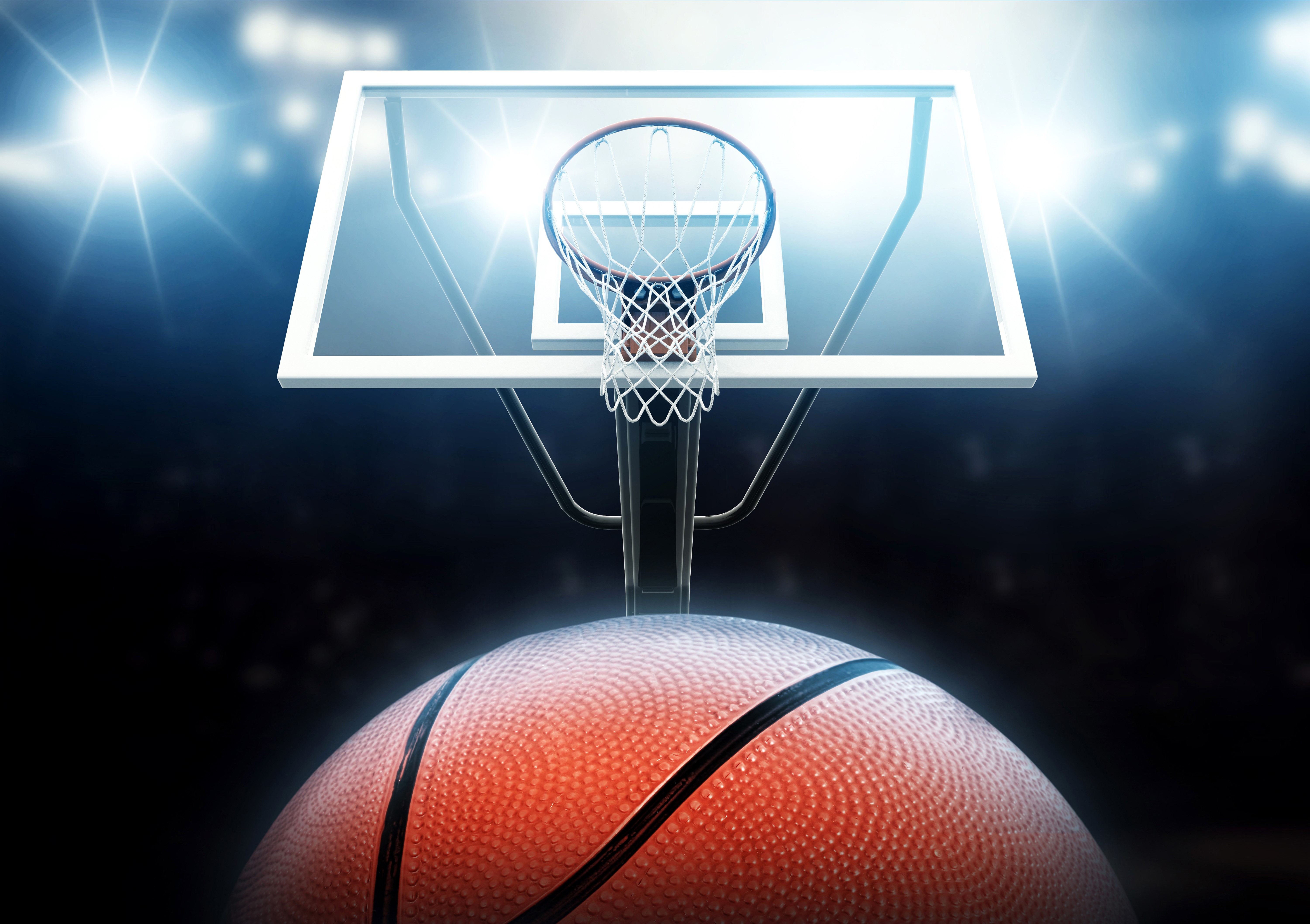 Basketball hoop and ball with stadium lights HD Wallpaper