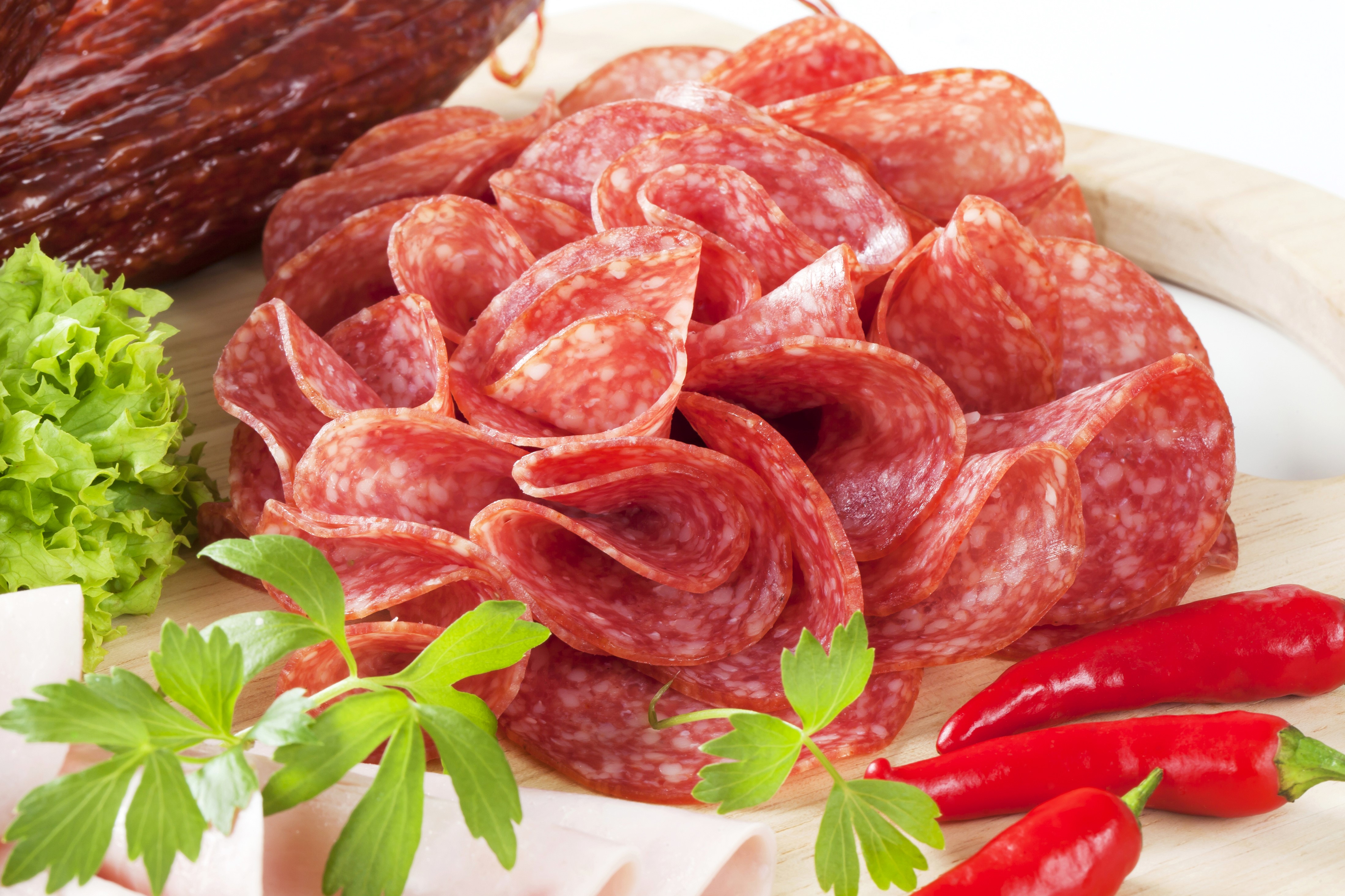 Sliced salami with chili peppers and lettuce HD Wallpaper
