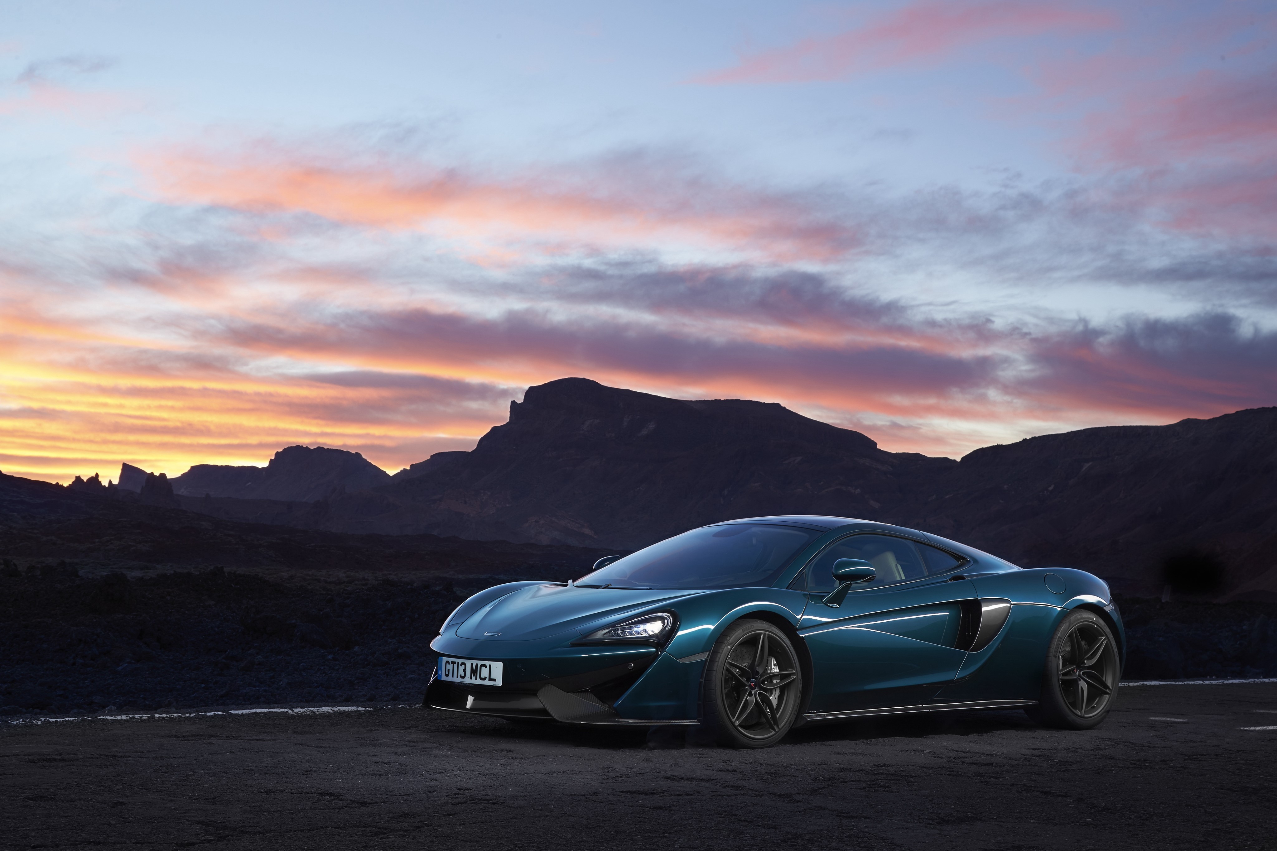 McLaren 570GT sports car at sunset HD Wallpaper
