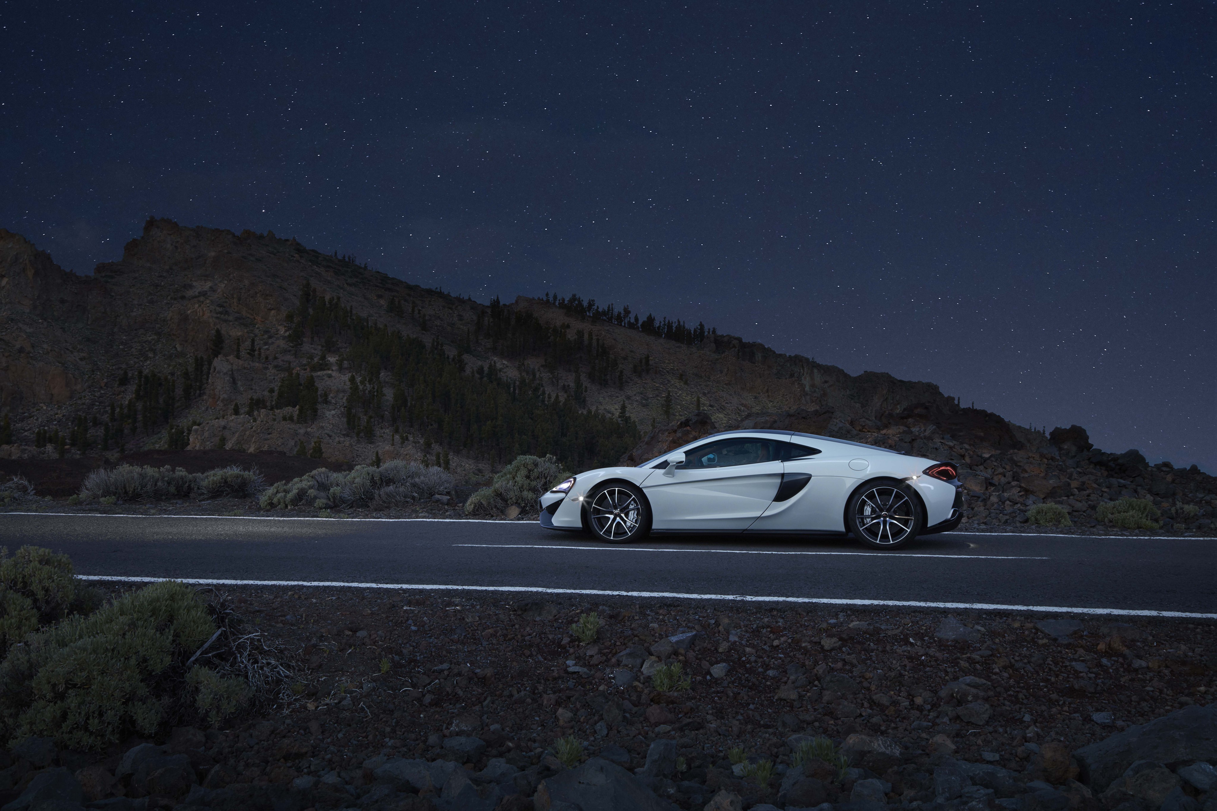 White McLaren 570GT on a Road at Night HD Wallpaper
