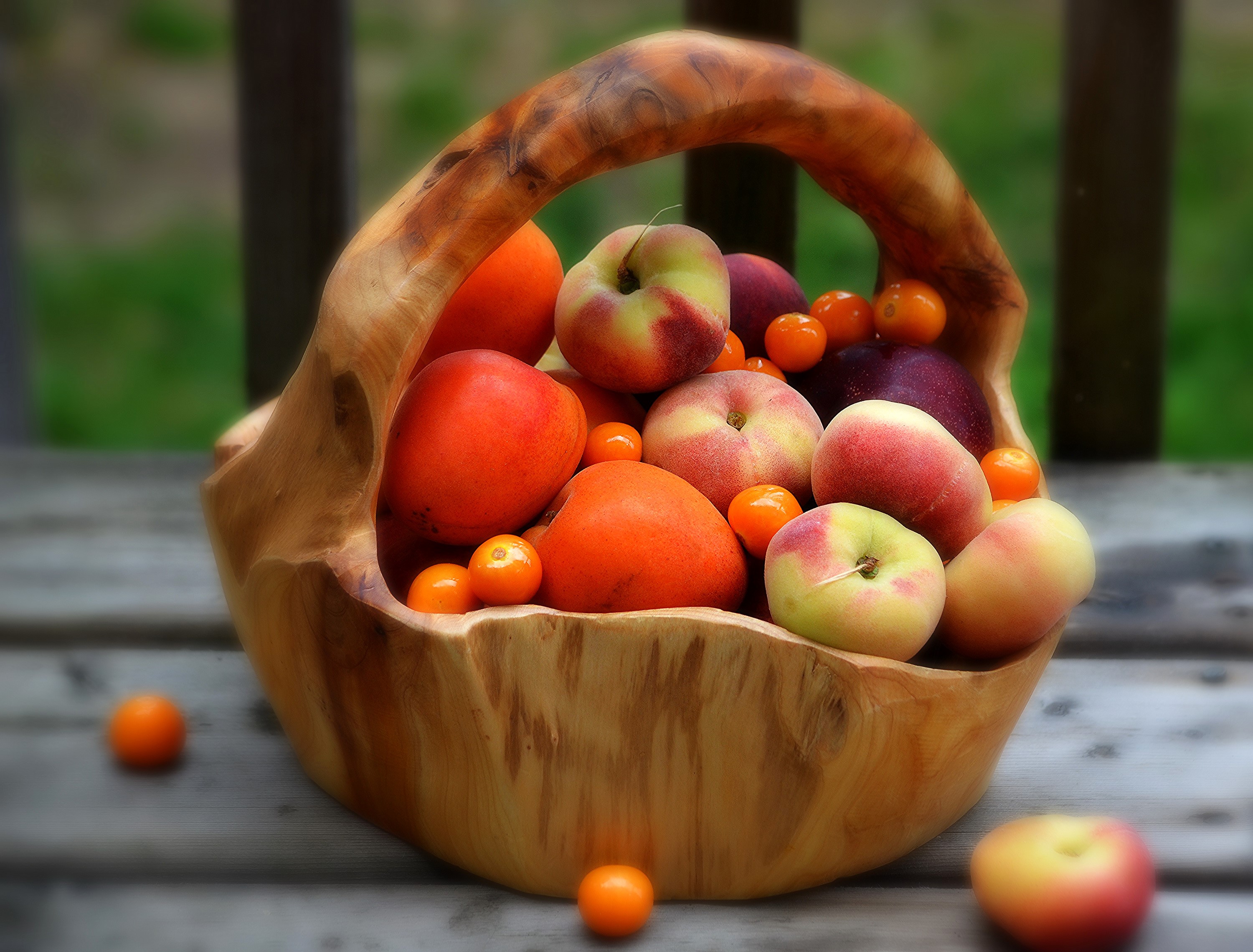 Basket of assorted fruits including peaches and plums HD Wallpaper