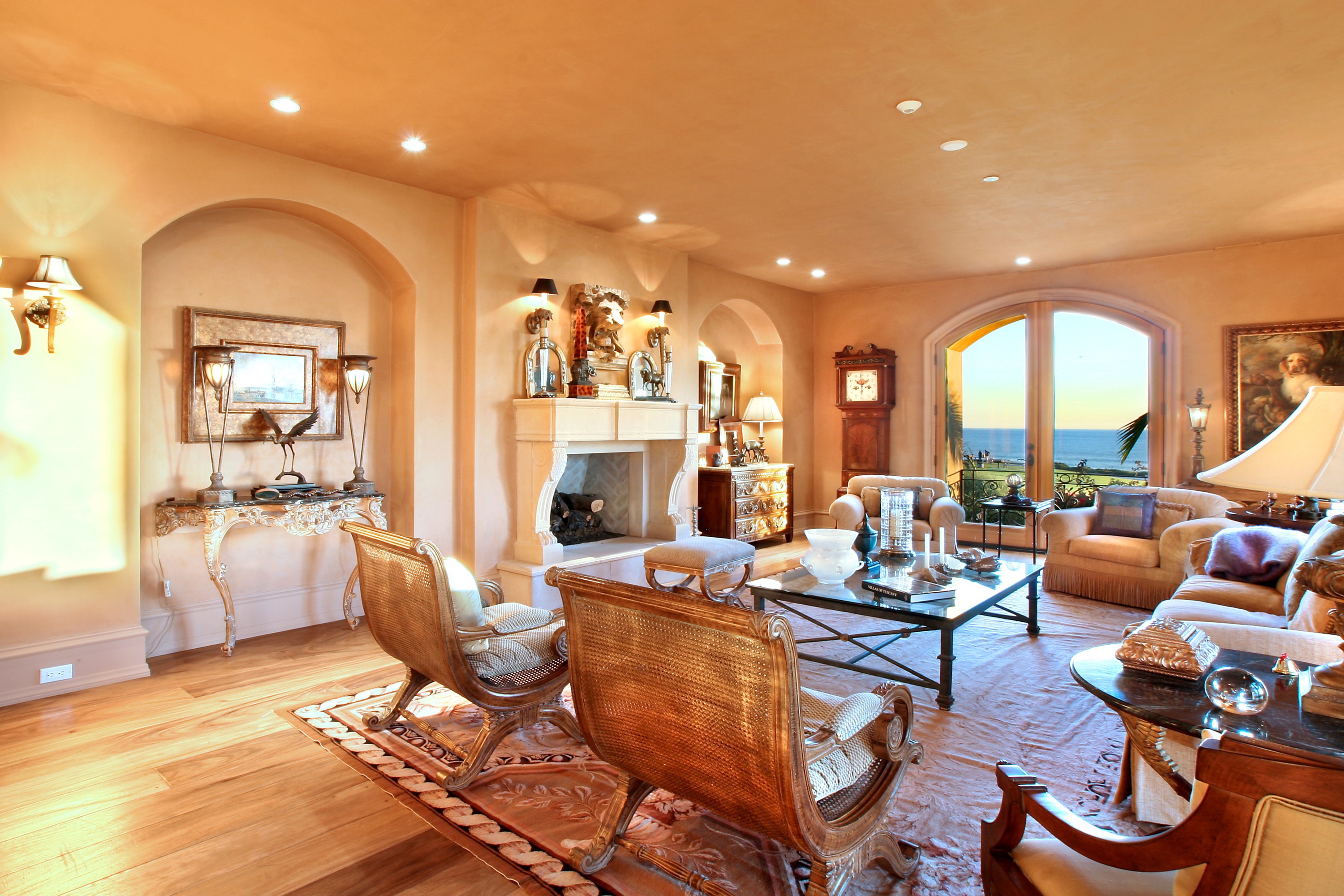 Luxury living room with fireplace and ocean view HD Wallpaper