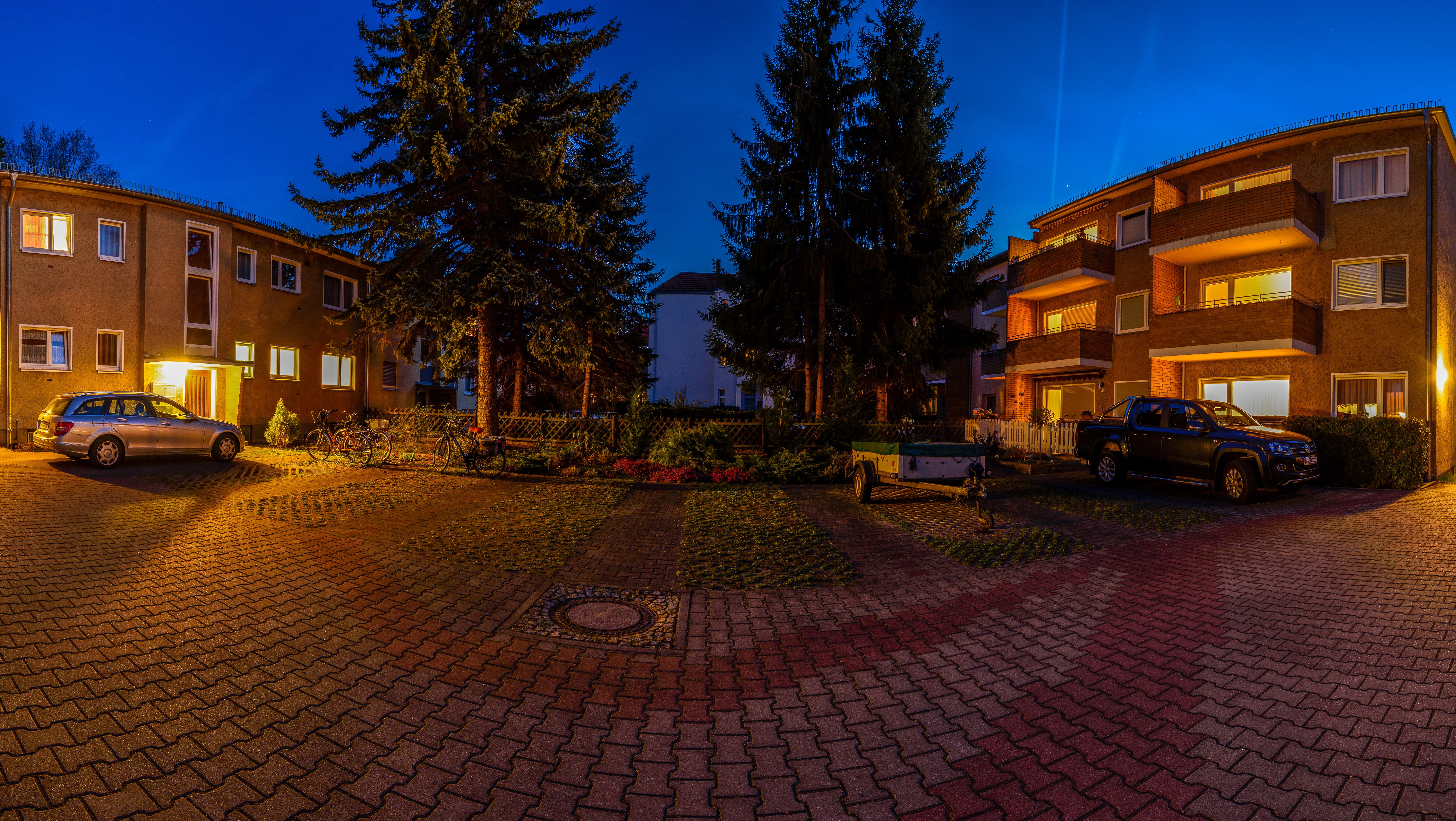 Apartment buildings and cars at night in Germany HD Wallpaper
