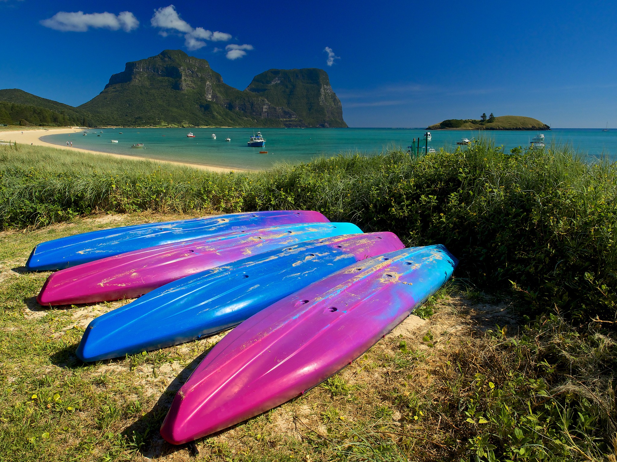 Kayaks on beach with Lord Howe Island mountains in background HD Wallpaper