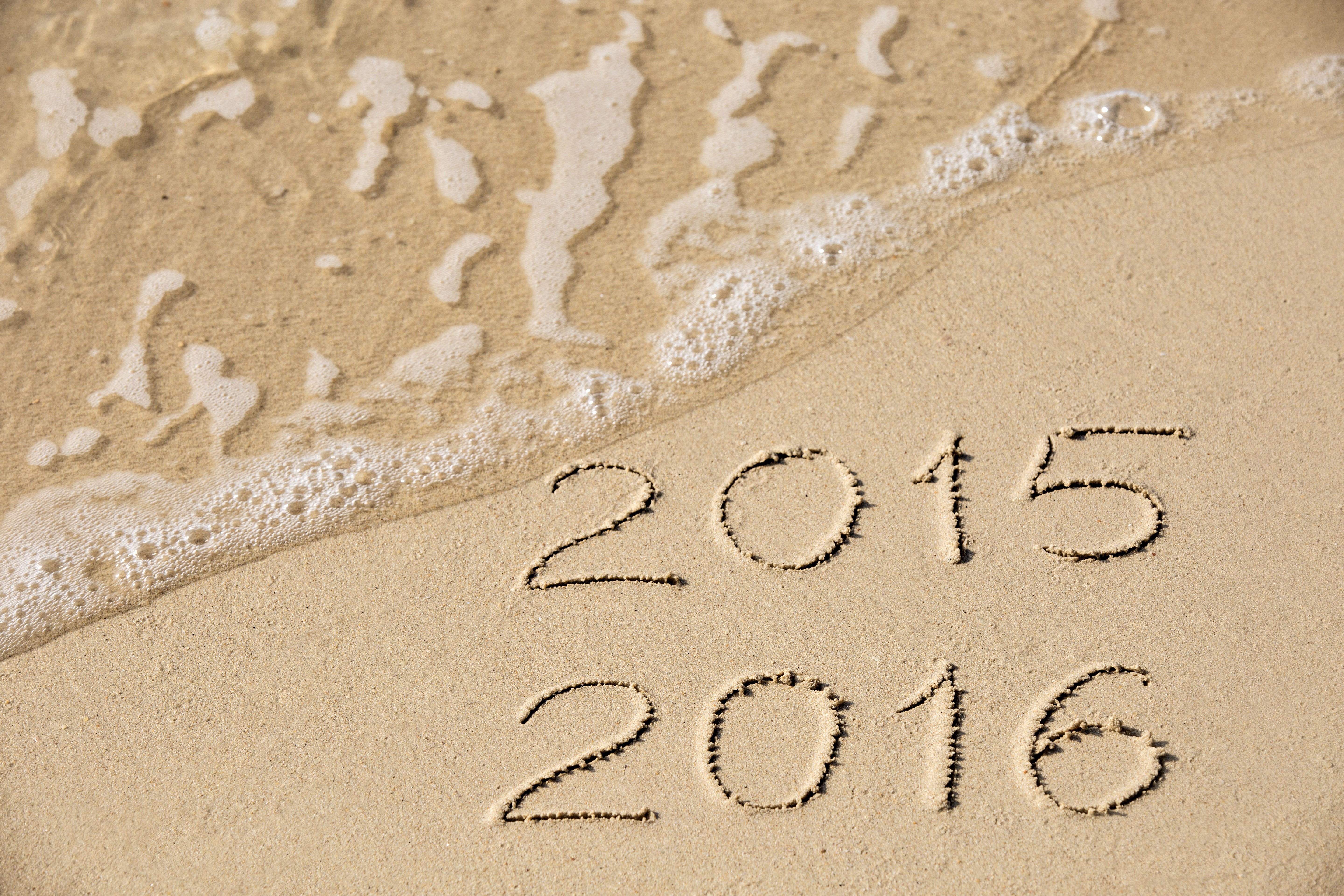 2015 and 2016 written in sand with waves HD Wallpaper
