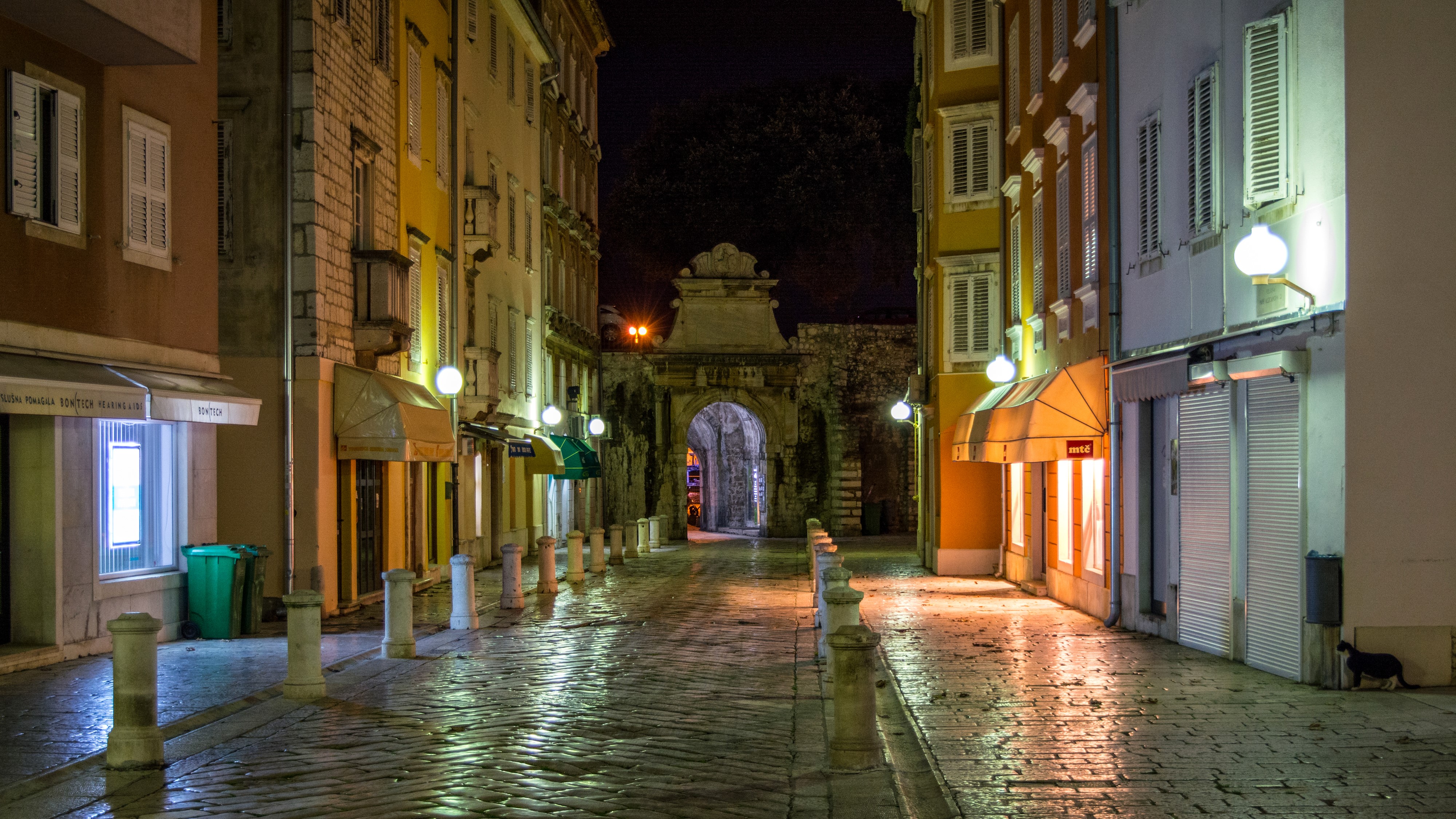 Street at night with archway in Zadar, Croatia HD Wallpaper