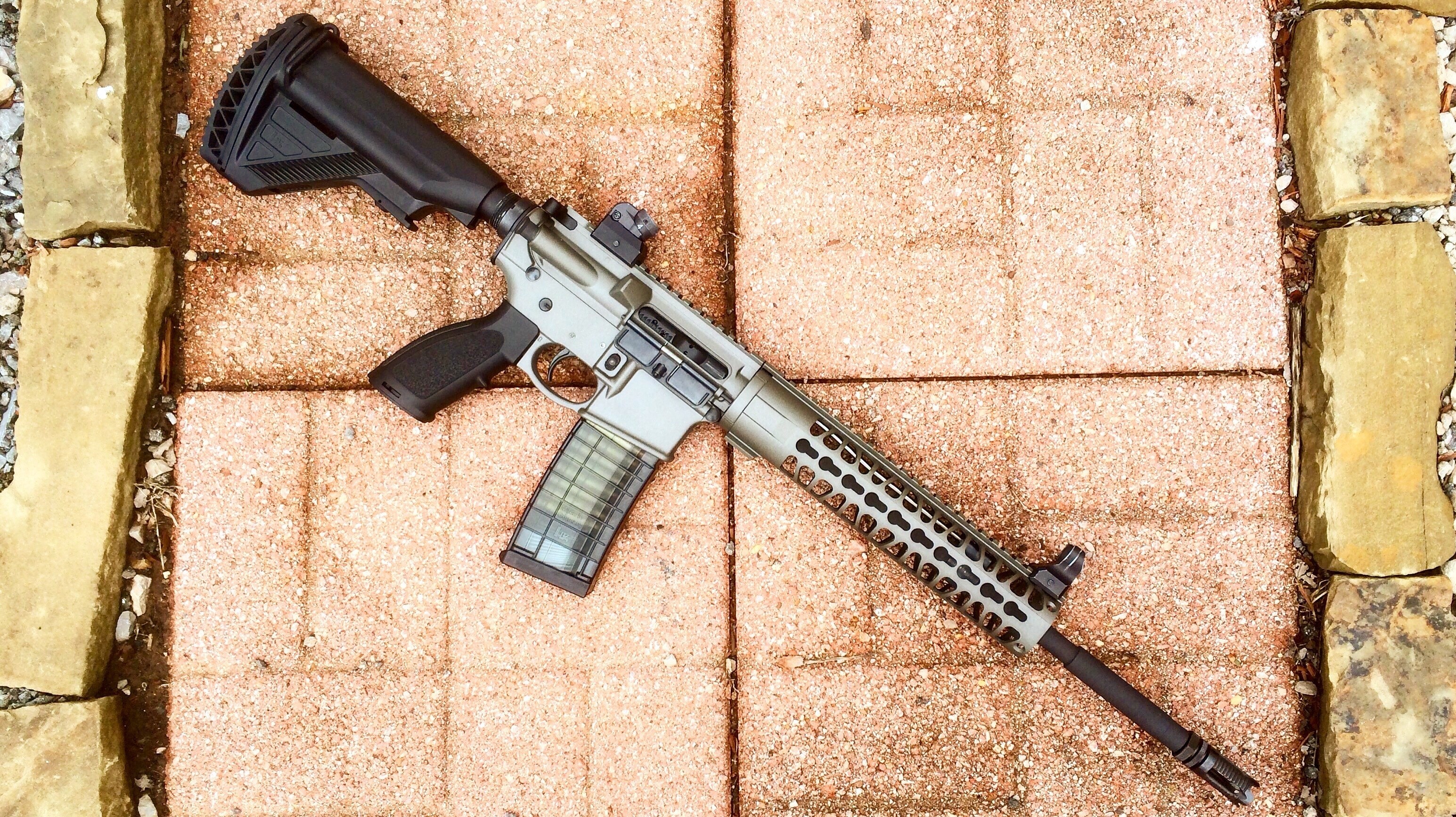 AR-15 rifle with magazine and red dot sight HD Wallpaper