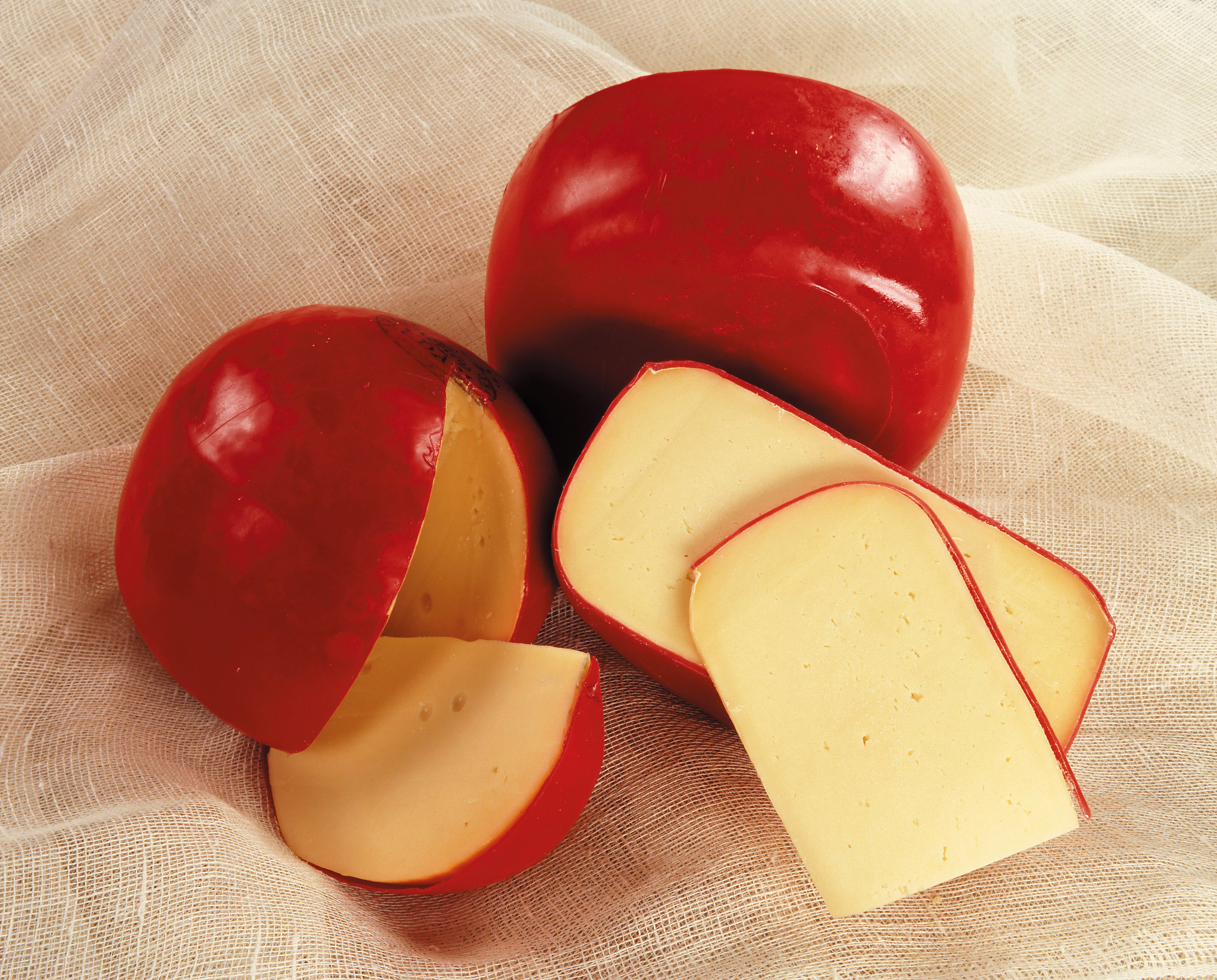 Red Wax Cheese Wheels and Slices HD Wallpaper