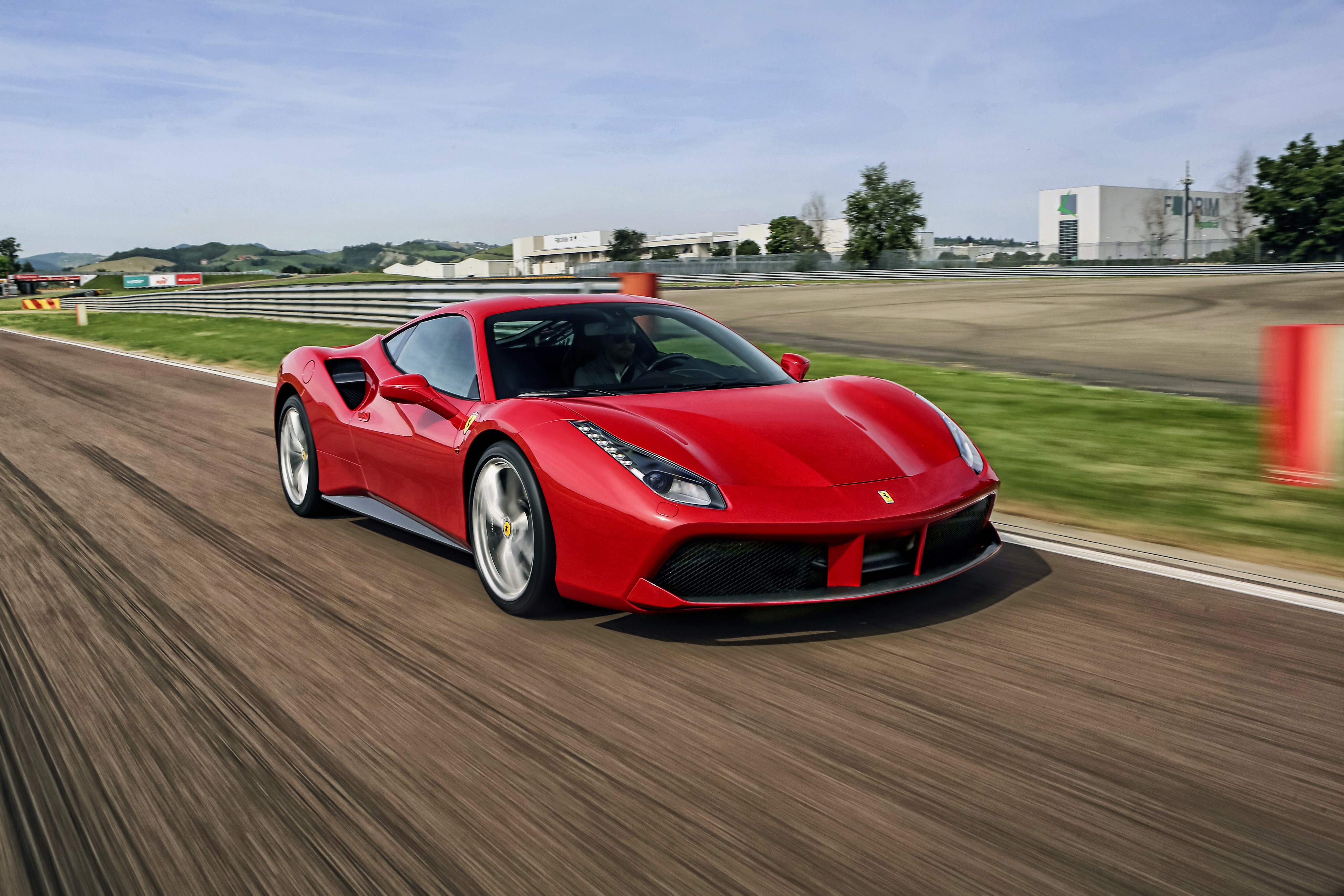 Red Ferrari 488 GTB on a Racetrack HD Wallpaper